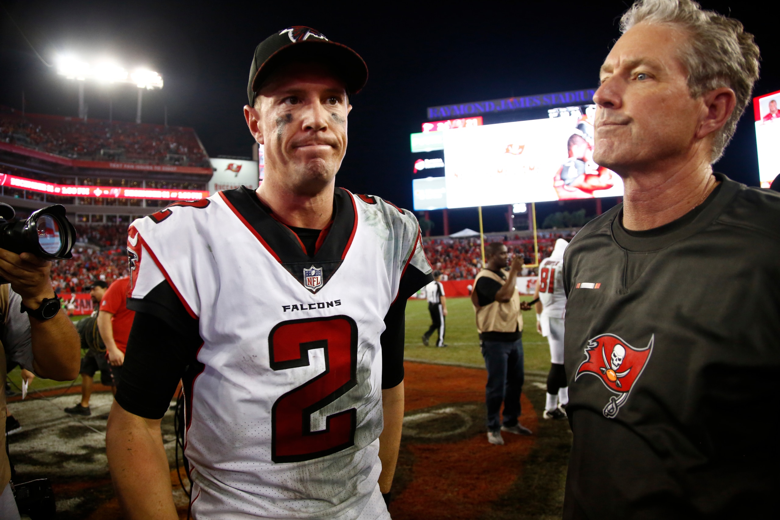 TAMPA, FL - DECEMBER 18:  Quarterback Matt Ryan #2 of the Atlanta Falcons and head coach Dirk Koetter of the Tampa Bay Buccaneers meet up on the field following the Falcons' 24-21 at an NFL football game on December 18, 2017 at Raymond James Stadium in Ta