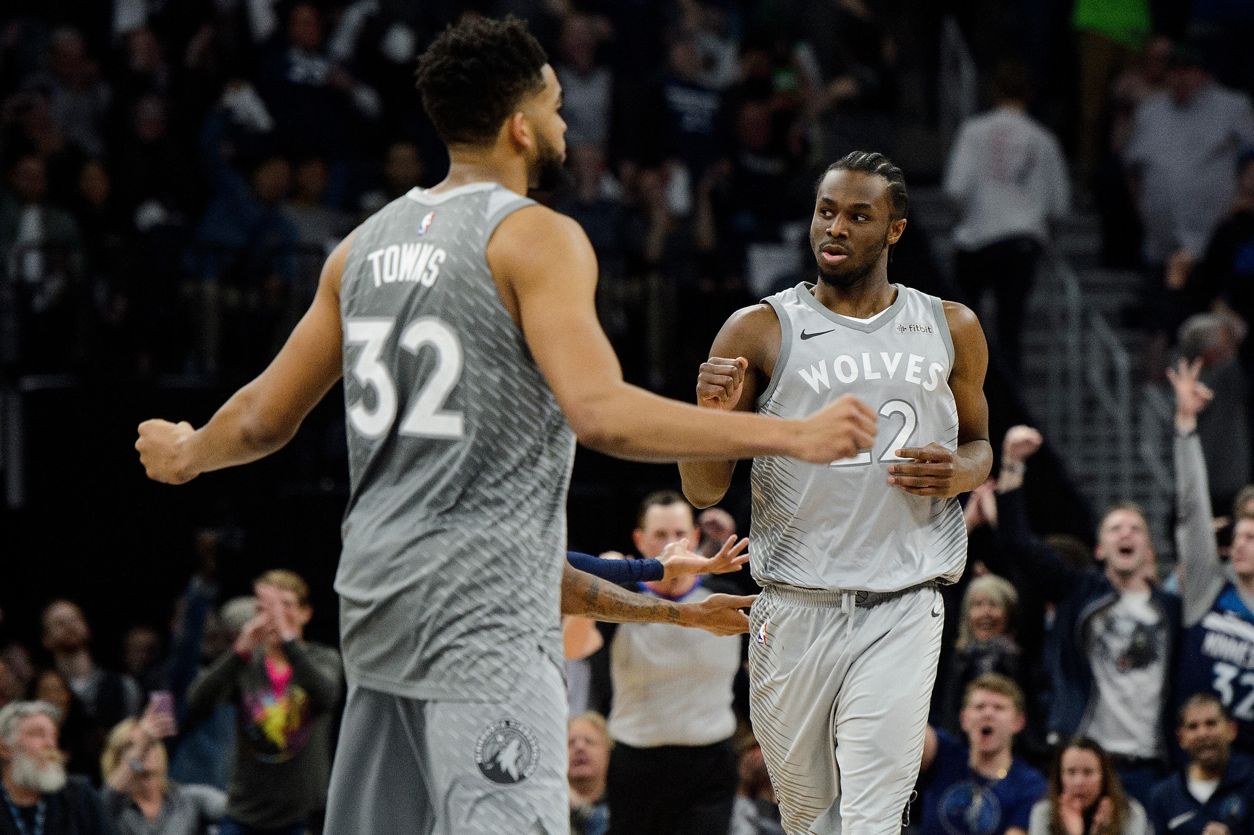 MINNEAPOLIS, MN - APRIL 11: Karl-Anthony Towns #32 and Andrew Wiggins #22 of the Minnesota Timberwolves celebrate a play against the Denver Nuggets during the game on April 11, 2018 at the Target Center in Minneapolis, Minnesota. The Timberwolves defeated