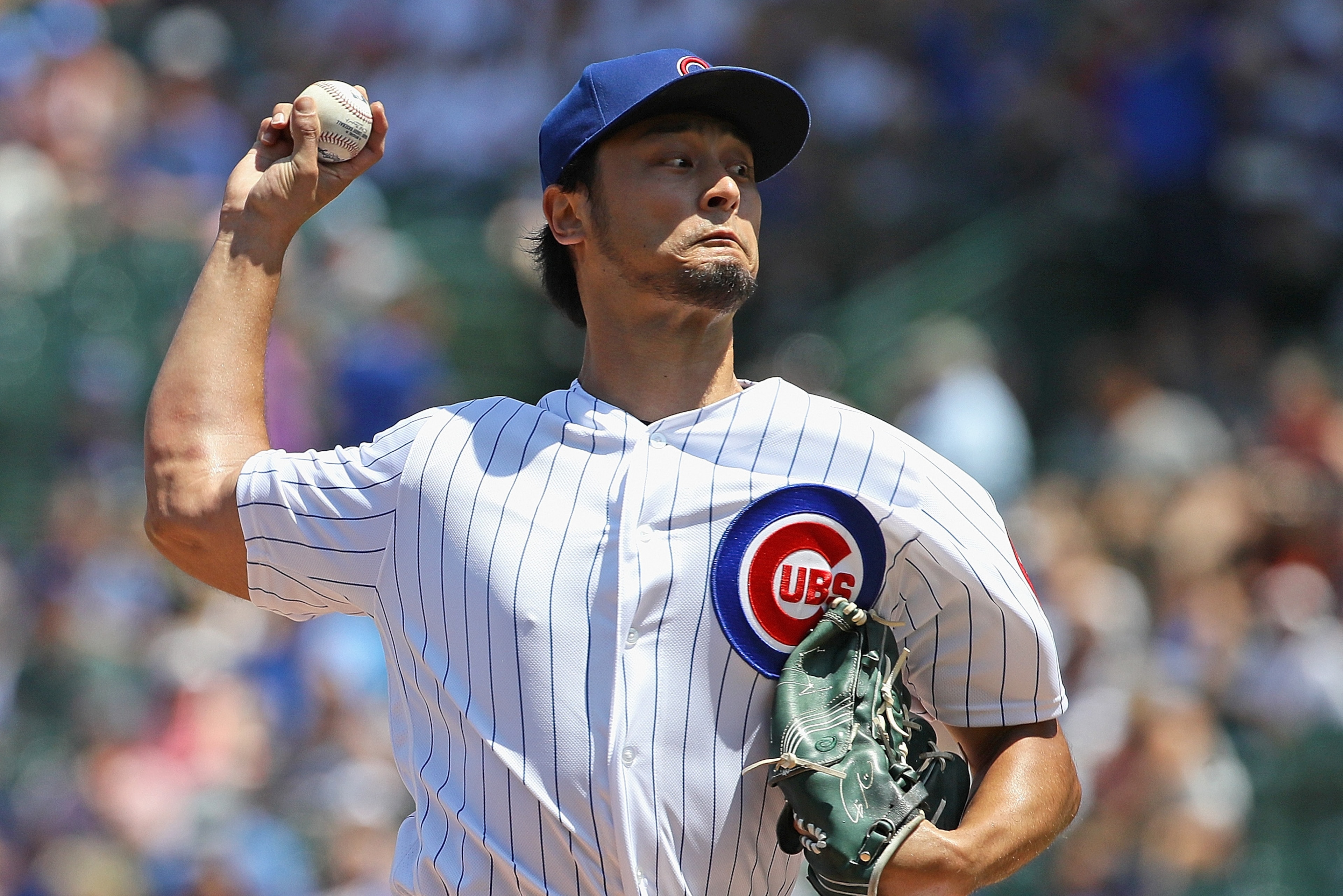 CHICAGO, ILLINOIS - JULY 17: Starting pitcher Yu Darvish #11 of the Chicago Cubs delivers the ball against the Cincinnati Reds at Wrigley Field on July 17, 2019 in Chicago, Illinois. (Photo by Jonathan Daniel/Getty Images)