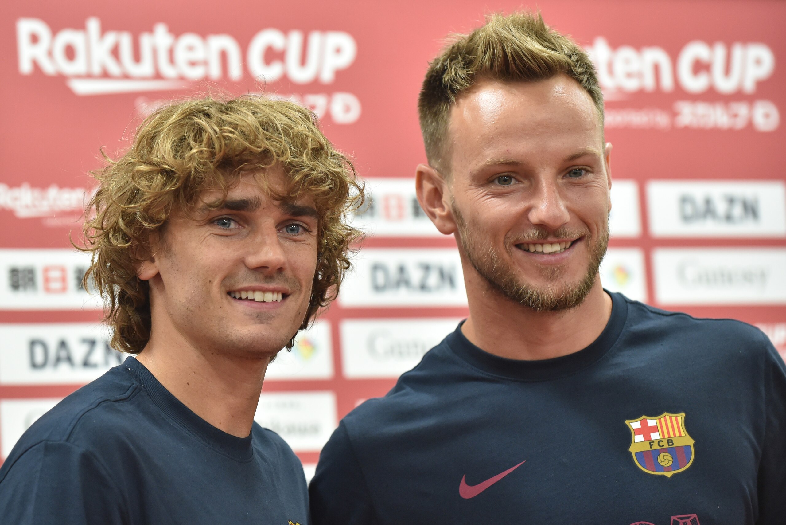 Barcelona's French forward Antoine Griezmann (L) and Croatian midfielder Ivan Rakitic (R) pose for photos after a pre-match press conference ahead of their Rakuten Cup football match with Chelsea, in Machida, suburban Tokyo on July 22, 2019. (Photo by Kaz