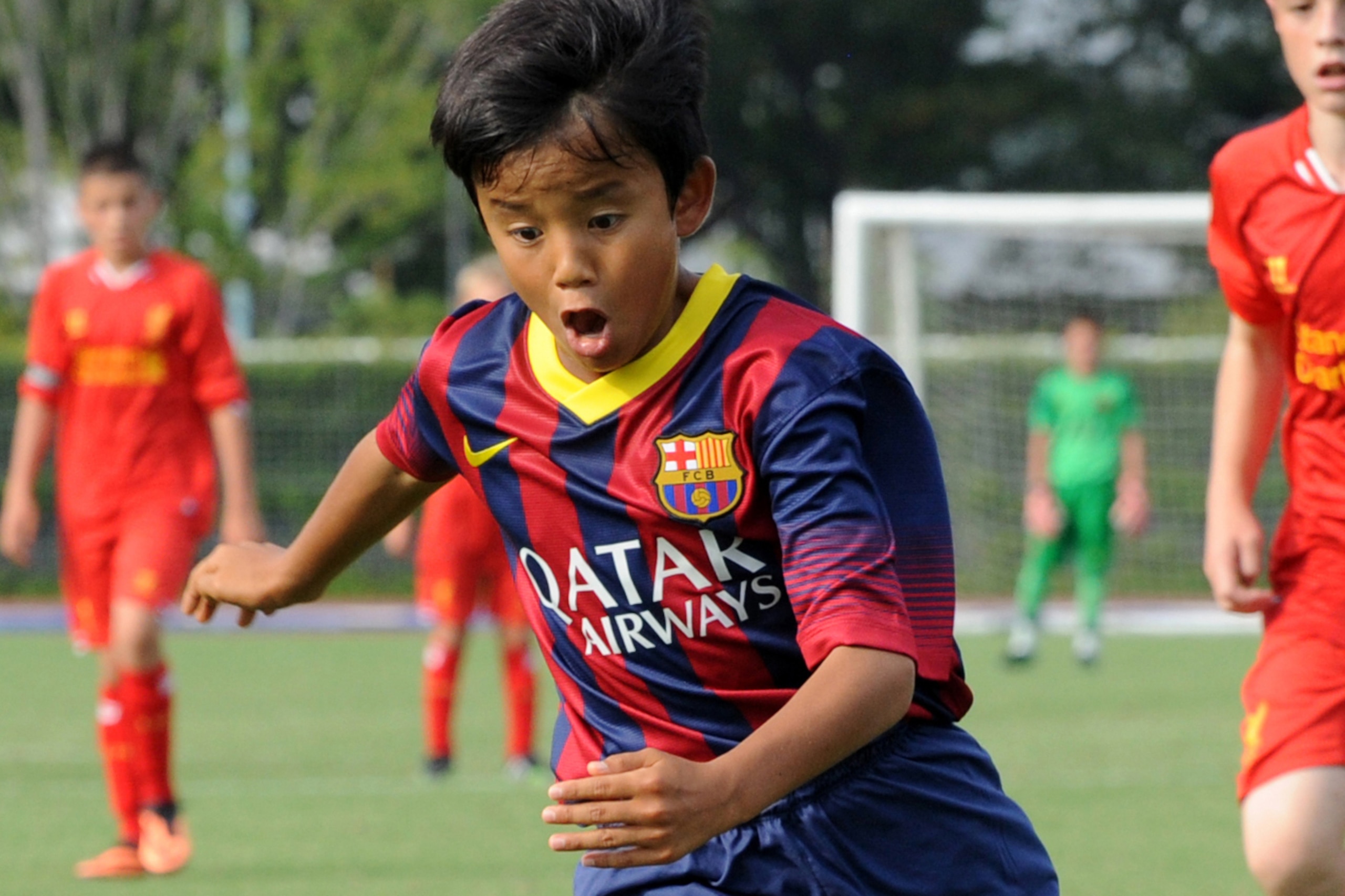 TOKYO, JAPAN - AUGUST 30: Takefusa Kubo of FC Barcelona in action during the U-12 Junior Soccer World Challenge 2013 final match between FC Barcelona and Liverpool FC at Ajinomoto Stadium on August 30, 2013 in Tokyo, Japan. (Photo by Etsuo Hara/Getty Imag