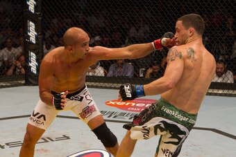 ABU DHABI, UNITED ARAB EMIRATES - APRIL 10:  Frankie Edgar (white/green shorts) def. BJ Penn (white shorts) - Unanimous decision during UFC 112 at Yas Island on April 10, 2010 in Abu Dhabi, United Arab Emirates. (Photo by Josh Hedges/Zuffa LLC via Getty I