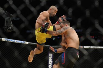 LAS VEGAS, NV - JULY 9: Jose Aldo knees Frankie Edgar during the UFC 200 event at T-Mobile Arena on July 9, 2016 in Las Vegas, Nevada. (Photo by Rey Del Rio/Getty Images)
