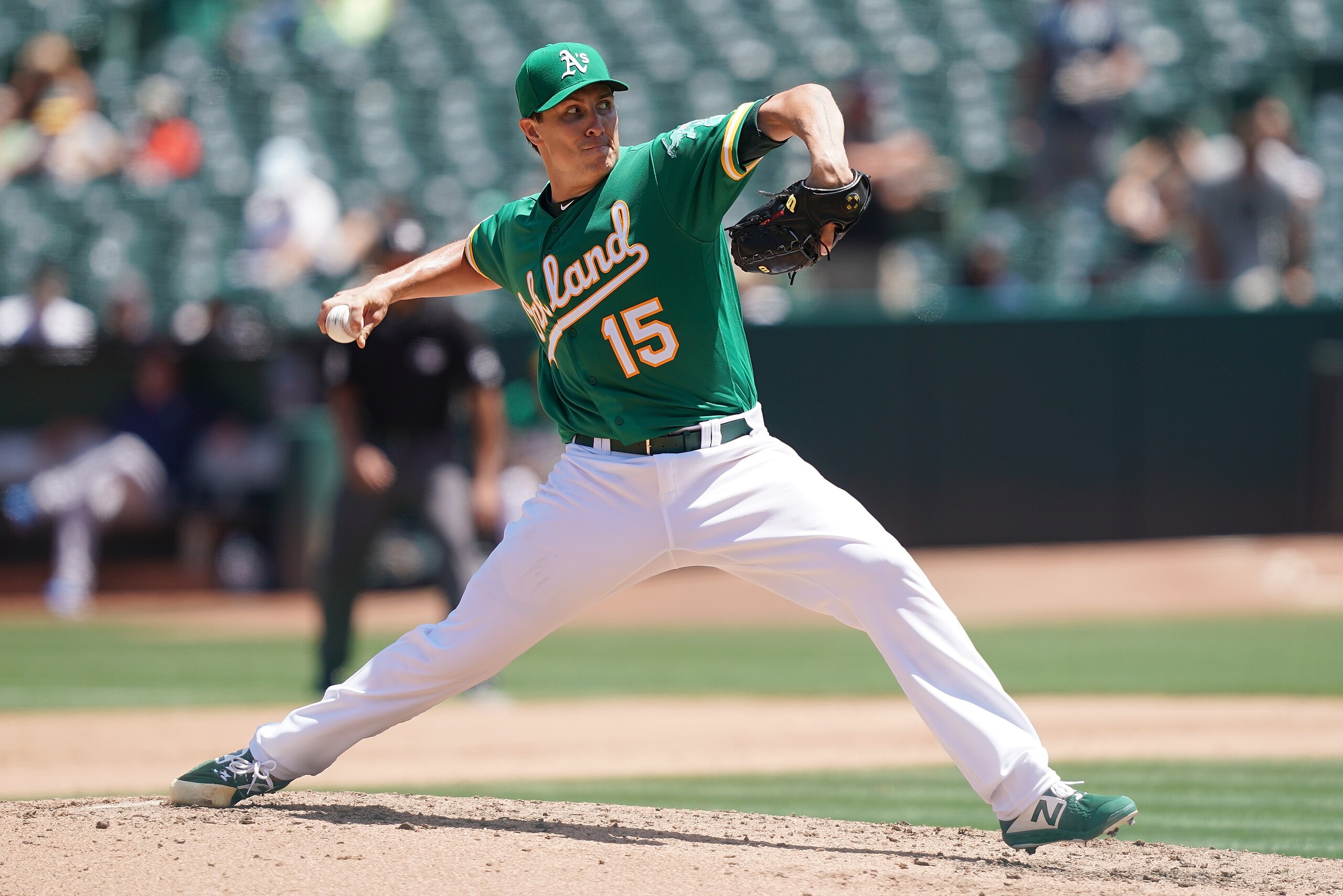 OAKLAND, CA - JULY 17:  Homer Bailey #15 of the Oakland Athletics pitches against the Seattle Mariners in the top of the fourth inning at Ring Central Coliseum on July 17, 2019 in Oakland, California.  (Photo by Thearon W. Henderson/Getty Images)