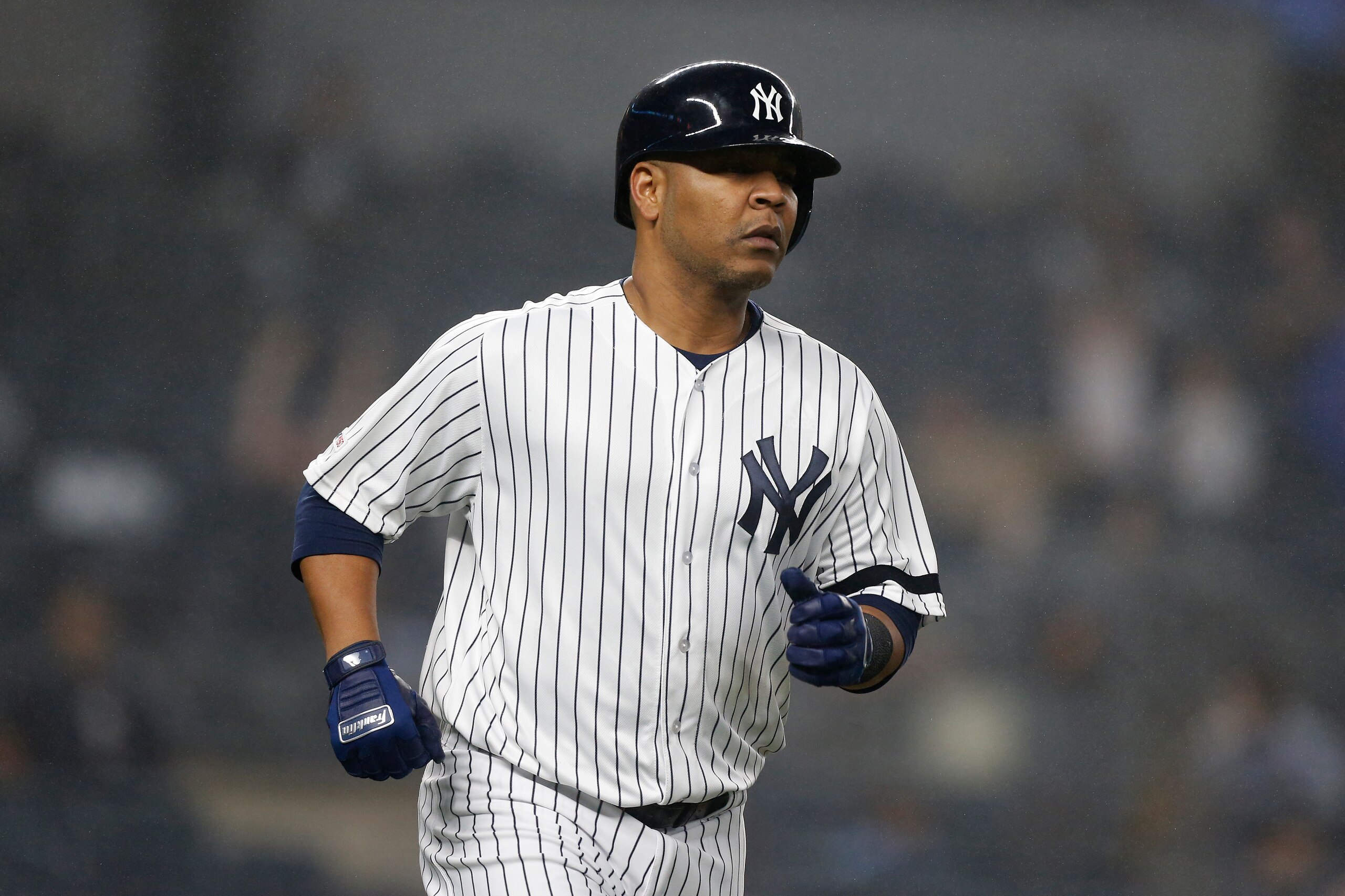 NEW YORK, NEW YORK - JUNE 18:   Edwin Encarnacion #30 of the New York Yankees runs the bases after his eighth inning home run against the Tampa Bay Rays at Yankee Stadium on June 18, 2019 in New York City. The Yankees defeated the Rays 6-3. (Photo by Jim 
