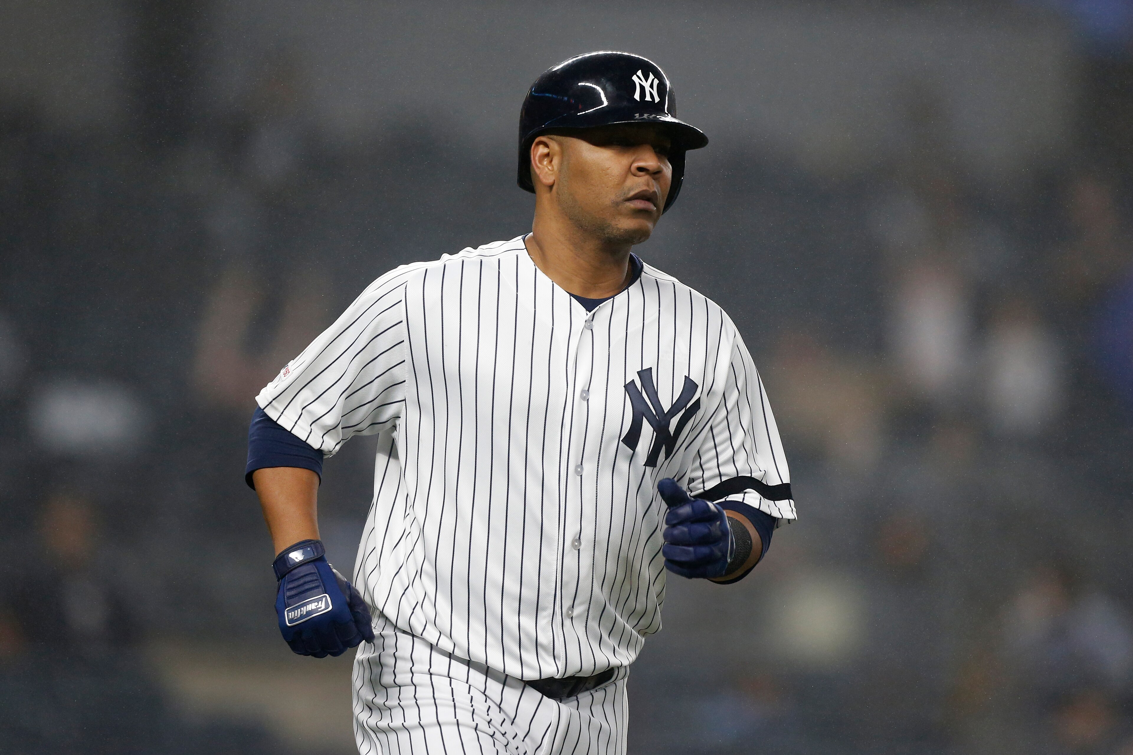 NEW YORK, NEW YORK - JUNE 18:   Edwin Encarnacion #30 of the New York Yankees runs the bases after his eighth inning home run against the Tampa Bay Rays at Yankee Stadium on June 18, 2019 in New York City. The Yankees defeated the Rays 6-3. (Photo by Jim 