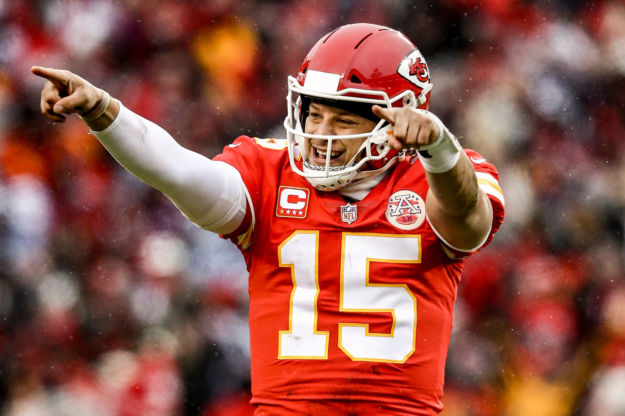KANSAS CITY, MO - JANUARY 12: Patrick Mahomes #15 of the Kansas City Chiefs points to the sidelines in celebration after throwing a touchdown against the Kansas City Chiefs during the first quarter of the AFC Divisional Round playoff game at Arrowhead Sta