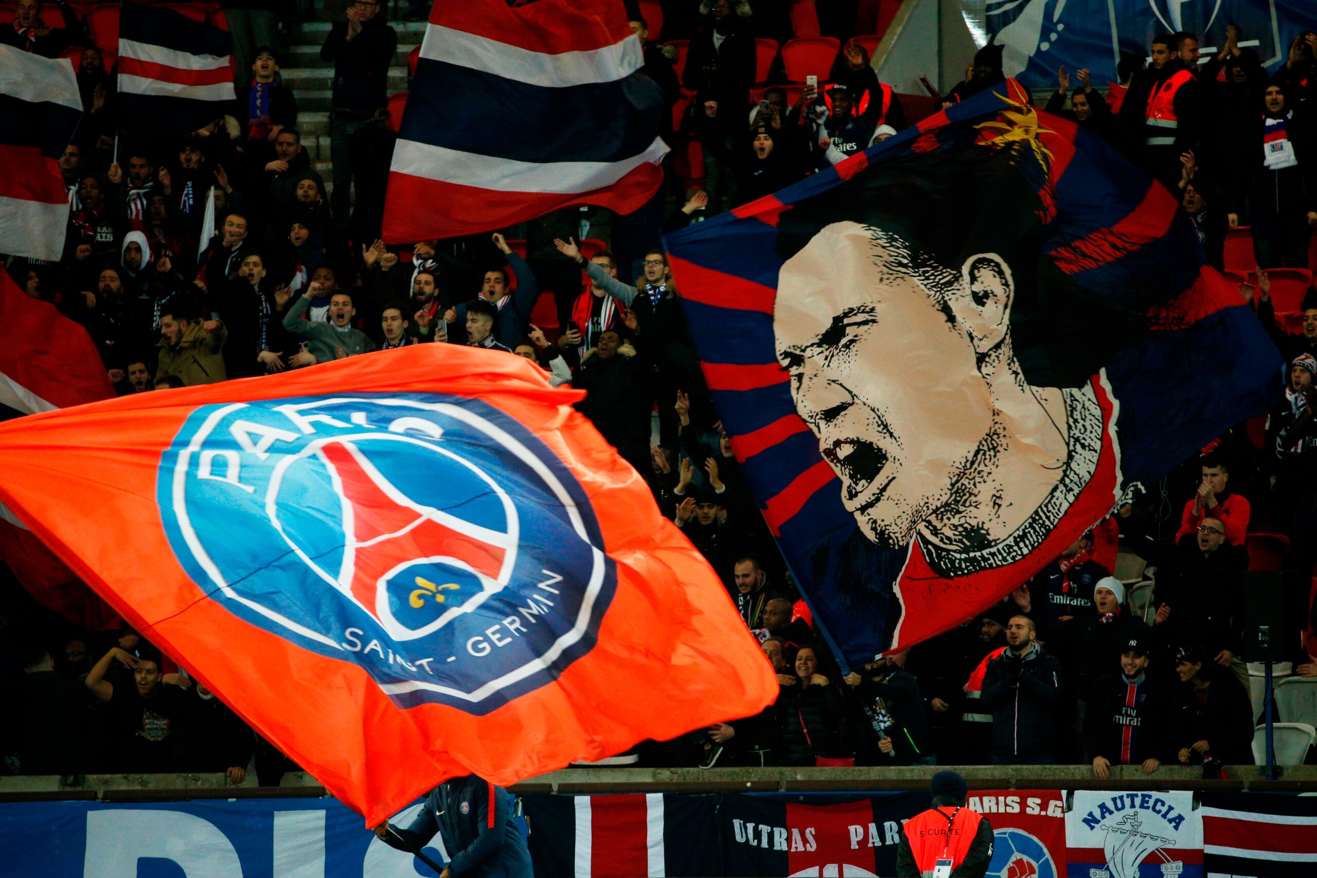 Paris Saint-Germain's supporters wave flags during the French Cup round of 16 football match between Paris Saint-Germain (PSG) and Guingamp (EAG) at the Parc des Princes stadium in Paris on January 24, 2018. / AFP PHOTO / GEOFFROY VAN DER HASSELT Paris Saint-Germain's supporters wave flags during the French Cup round of 16 football match between Paris Saint-Germain (PSG) and Guingamp (EAG) at the Parc des Princes stadium in Paris on January 24, 2018. / AFP PHOTO / GEOFFROY VAN DER HASSELT