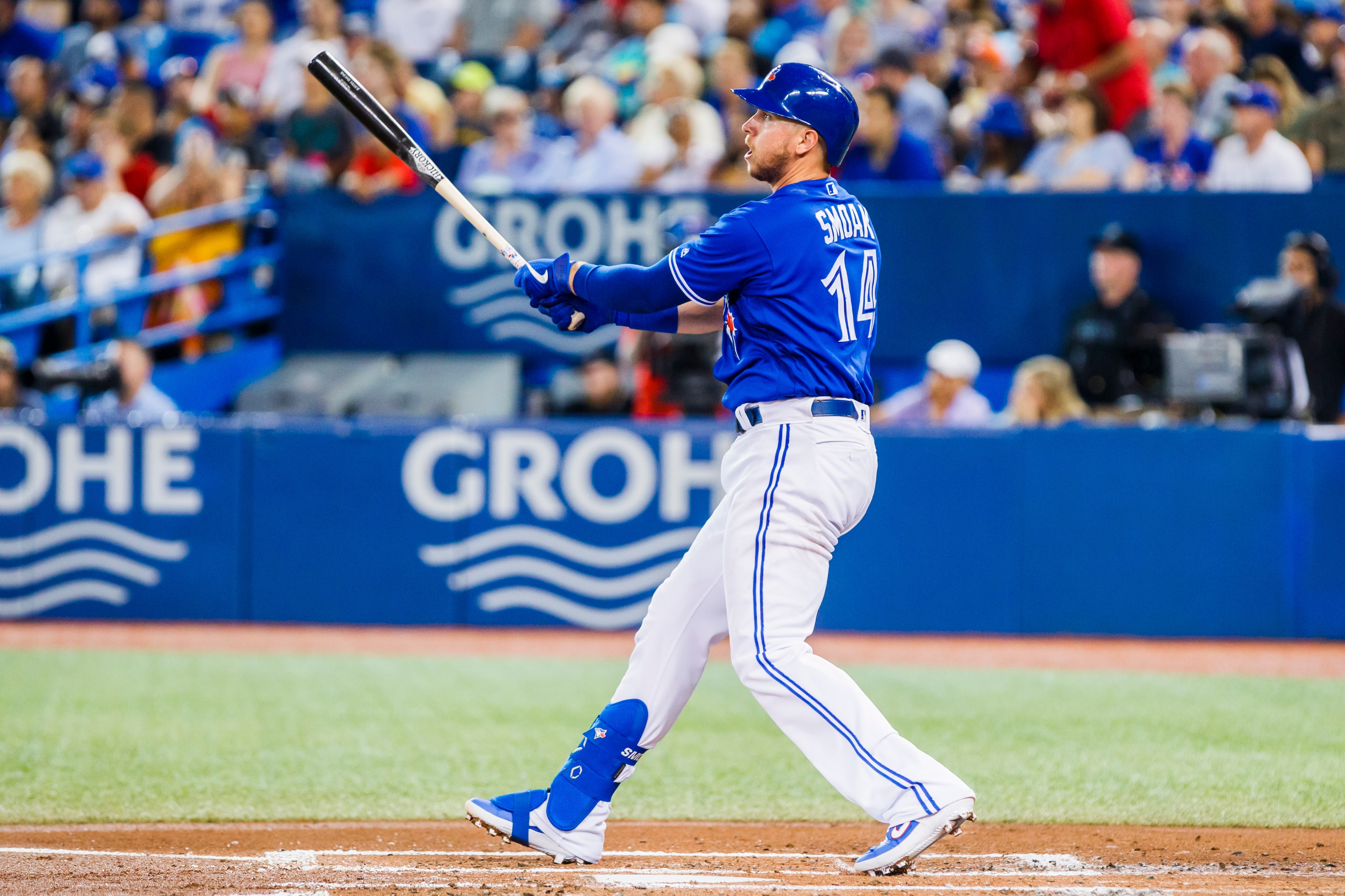 TORONTO, ONTARIO - JULY 28: Justin Smoak #14 of the Toronto Blue Jays hits a home run against the Tampa Bay Rays in the second inning during their MLB game at the Rogers Centre on July 28, 2019 in Toronto, Canada. (Photo by Mark Blinch/Getty Images)