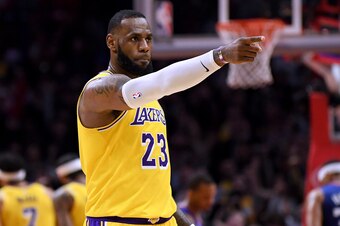 LOS ANGELES, CALIFORNIA - JANUARY 31:  LeBron James #23 of the Los Angeles Lakers reacts to a basket from Lance Stephenson #6 during a 123-120 win over the LA Clippers at Staples Center on January 31, 2019 in Los Angeles, California.  NOTE TO USER: User e