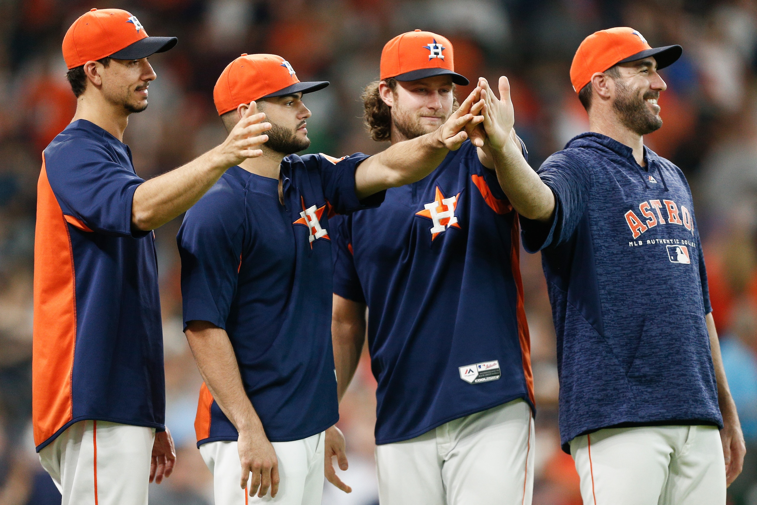 HOUSTON, TX - JULY 08:  (L-R) Charlie Morton #50 of the Houston Astros, Lance McCullers Jr. #43, Gerrit Cole #45 and Justin Verlander #35 wait to celebrate with the team after defeating the Chicago White Sox 2-1 at Minute Maid Park on July 8, 2018 in Hous