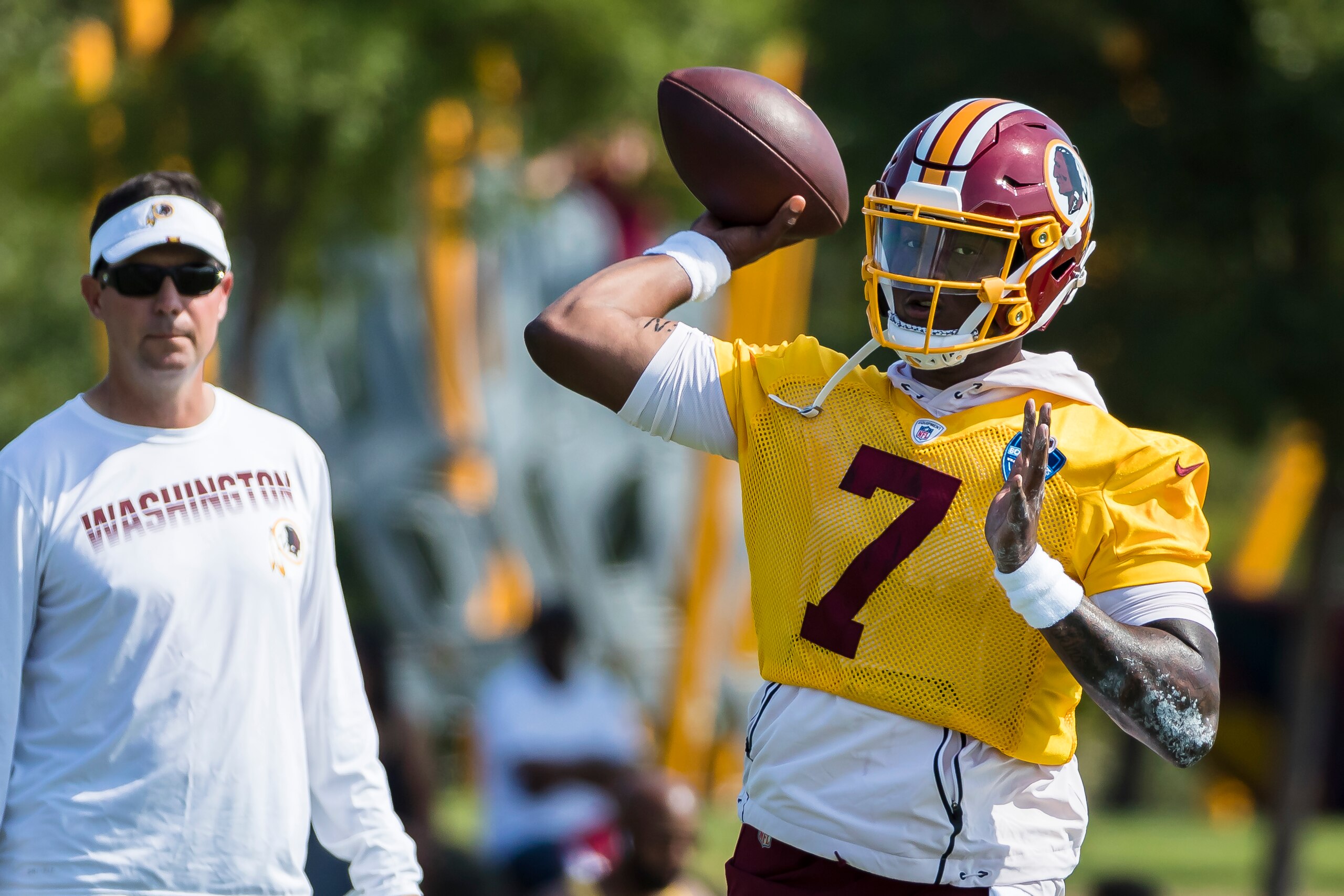 RICHMOND, VA - JULY 26: Dwayne Haskins #7 of the Washington Redskins attempts a pass as quarterbacks coach Tim Rattay looks on during training camp at Bon Secours Washington Redskins Training Center on July 26, 2019 in Richmond, Virginia. (Photo by Scott 