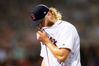 BOSTON, MA - AUGUST 1: Andrew Cashner #48 of the Boston Red Sox reacts as he exits the game during the sixth inning of a game against the Tampa Bay Rays on August 1, 2019 at Fenway Park in Boston, Massachusetts. (Photo by Billie Weiss/Boston Red Sox/Getty