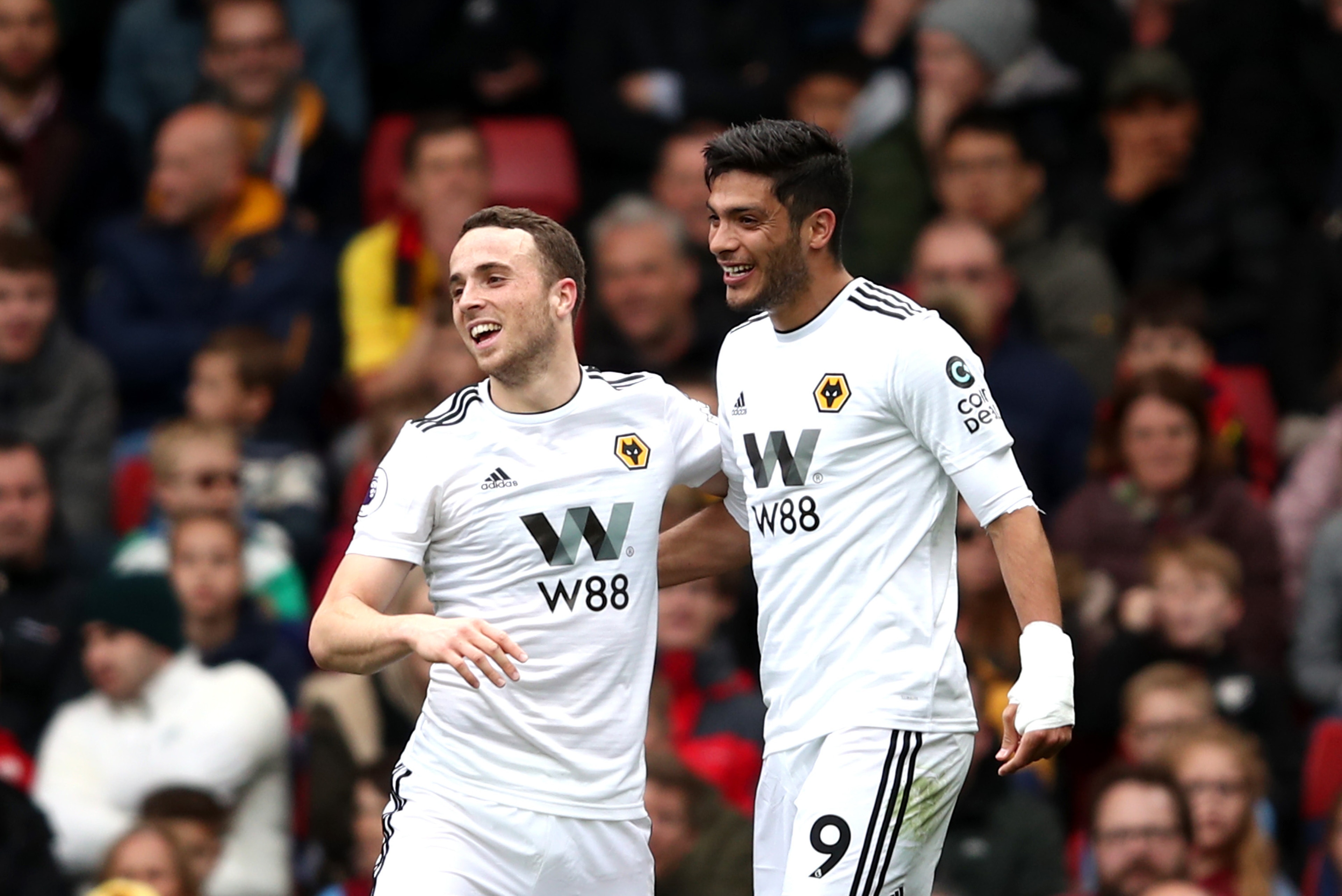 WATFORD, ENGLAND - APRIL 27:  Diogo Jota of Wolverhampton Wanderers (L) and Raul Jimenez of Wolverhampton Wanderers celebrates during the Premier League match between Watford FC and Wolverhampton Wanderers at Vicarage Road on April 27, 2019 in Watford, Un