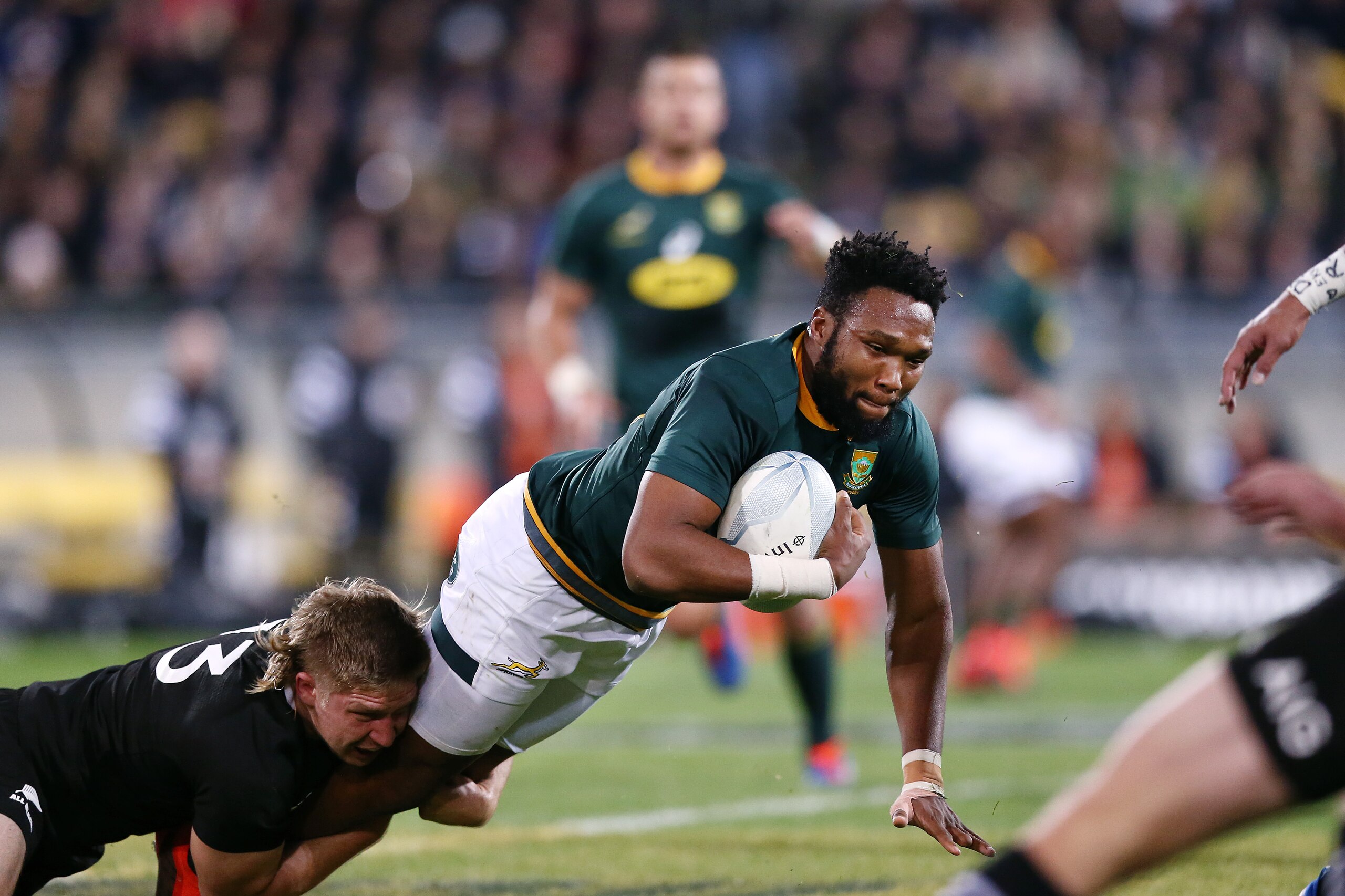 WELLINGTON, NEW ZEALAND - JULY 27: Lukhanyo Am of the Springboks is tackled by Jack Goodhue of the All Blacks during the 2019 Rugby Championship Test Match between New Zealand and South Africa at Westpac Stadium on July 27, 2019 in Wellington, New Zealand WELLINGTON, NEW ZEALAND - JULY 27: Lukhanyo Am of the Springboks is tackled by Jack Goodhue of the All Blacks during the 2019 Rugby Championship Test Match between New Zealand and South Africa at Westpac Stadium on July 27, 2019 in Wellington, New Zealand