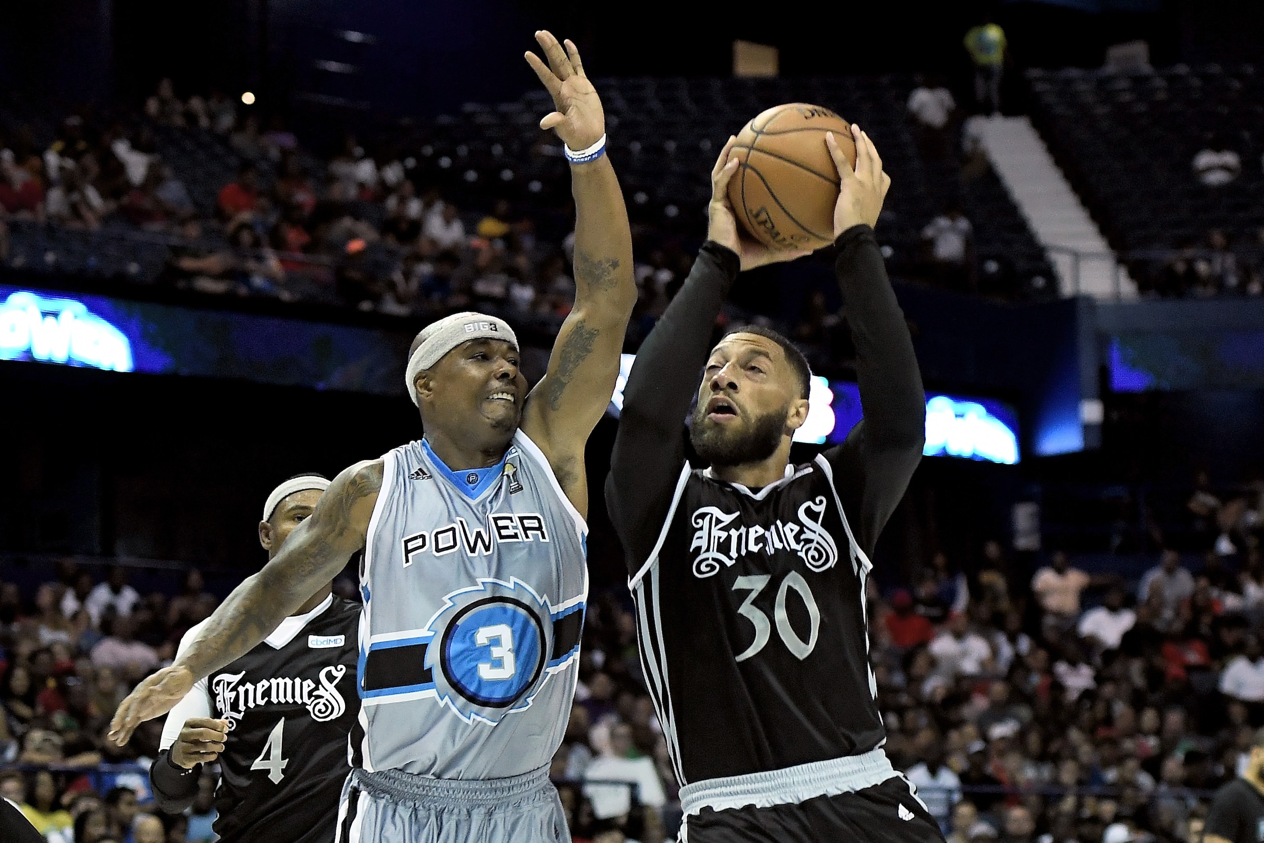 CHICAGO, ILLINOIS - AUGUST 03:  Royce White #30 of the Enemies attempts a shot while being guarded by Quentin Richardson #3 of the Power in the second half during week seven of the BIG3 three on three basketball league at Allstate Arena on August 03, 2019