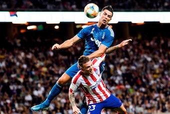 Juventus' Cristiano Ronaldo heads the ball over Atletico Madrid's Kieran Trippier during the International Champions Cup football match between Atletico Madrid v Juventus on August 10, 2019 in Solna outside Stockholm, Sweden. (Photo by Erik SIMANDER / TT 