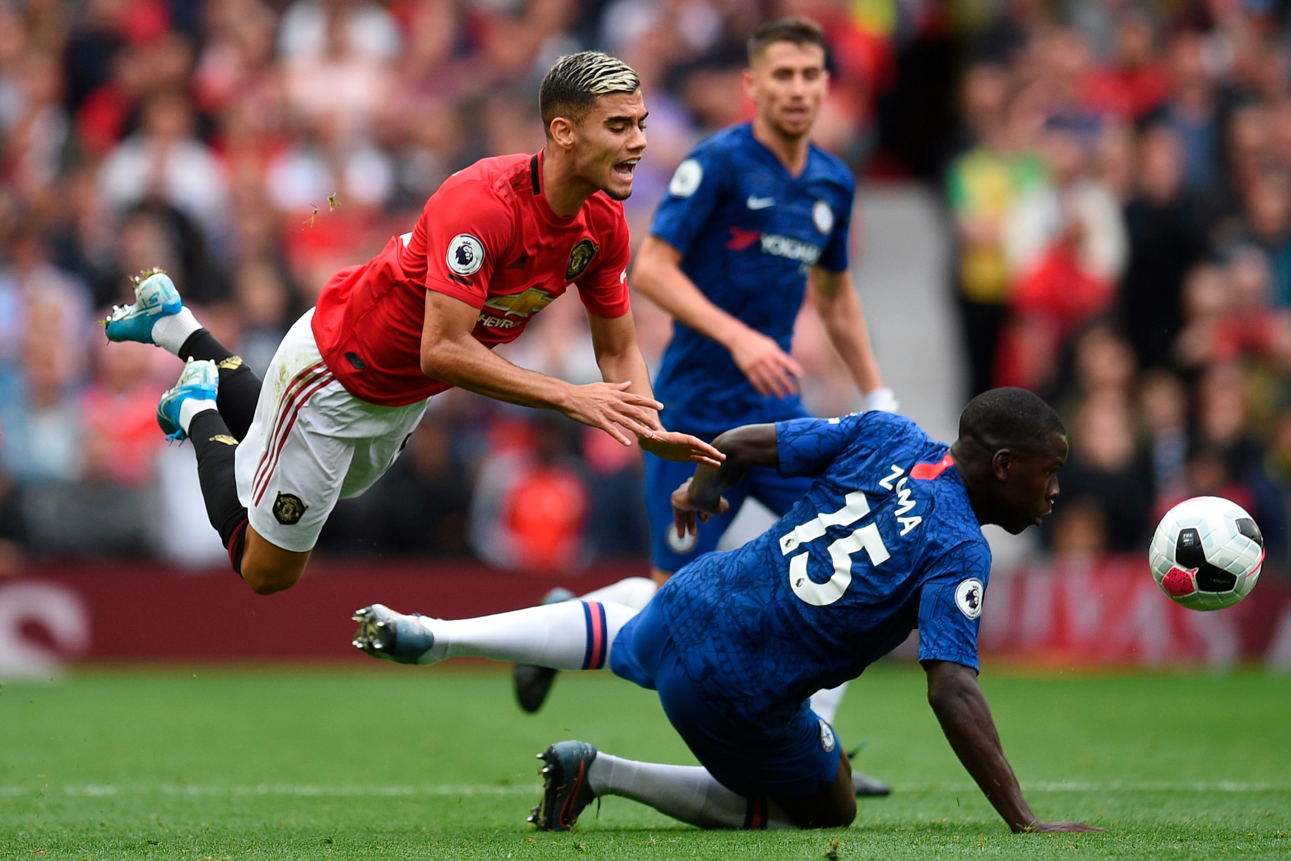 TOPSHOT - Manchester United's Belgian-born Brazilian midfielder Andreas Pereira (L) vies with Chelsea's French defender Kurt Zouma (R) during the English Premier League football match between Manchester United and Chelsea at Old Trafford in Manchester, no TOPSHOT - Manchester United's Belgian-born Brazilian midfielder Andreas Pereira (L) vies with Chelsea's French defender Kurt Zouma (R) during the English Premier League football match between Manchester United and Chelsea at Old Trafford in Manchester, no