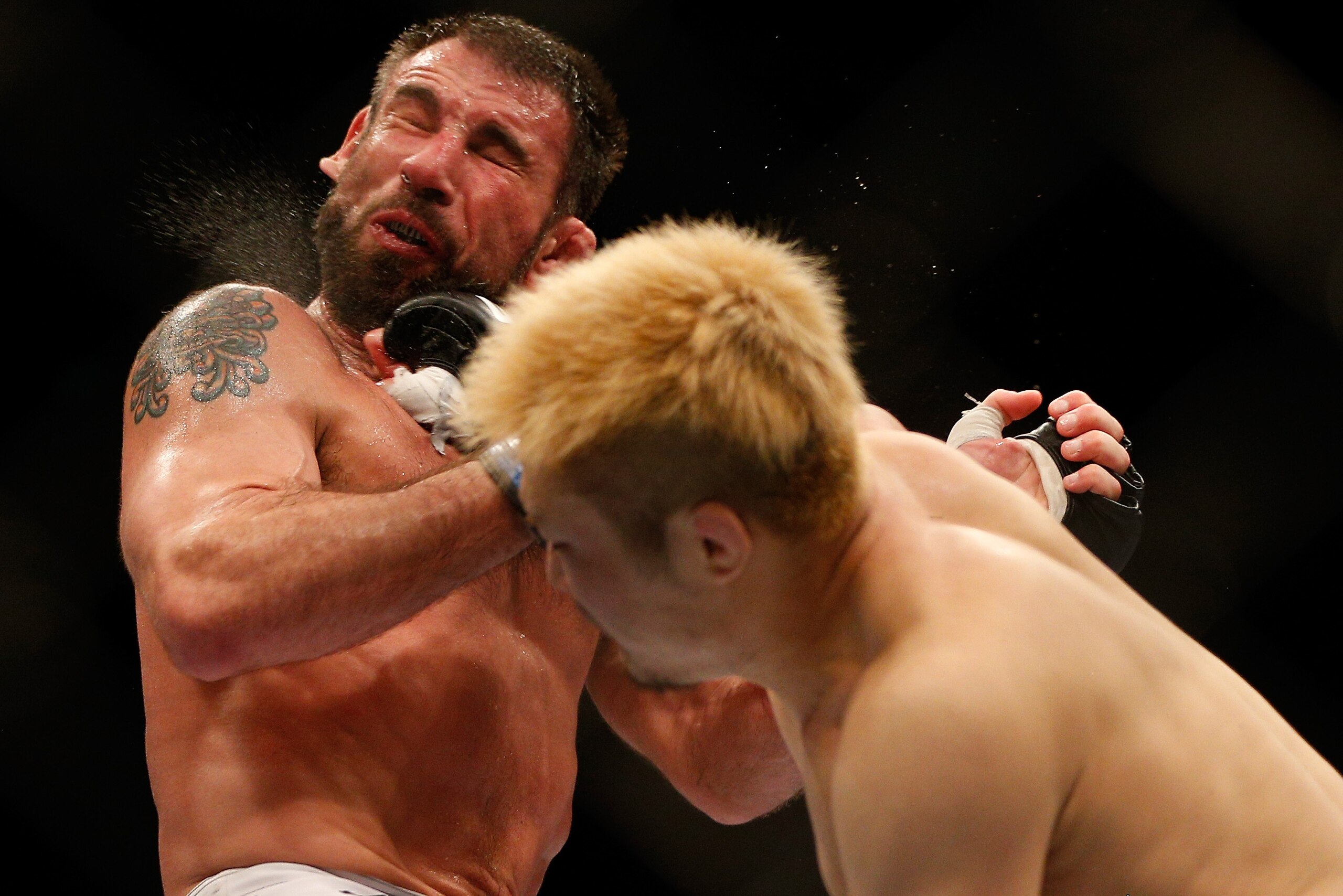 BALTIMORE, MD - APRIL 26:  (R-L) Takanori Gomi punches Isaac Vallie-Flagg in their lightweight bout during the UFC 172 event at the Baltimore Arena on April 26, 2014 in Baltimore, Maryland. (Photo by Josh Hedges/Zuffa LLC/Zuffa LLC via Getty Images)