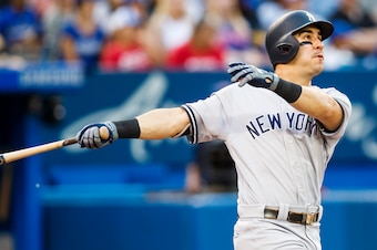TORONTO, ONTARIO - AUGUST 8: Mike Tauchman #39 of the New York Yankees hits a home run against the Toronto Blue Jays in the third inning during their MLB game at the Rogers Centre on August 8, 2019 in Toronto, Canada. (Photo by Mark Blinch/Getty Images)
