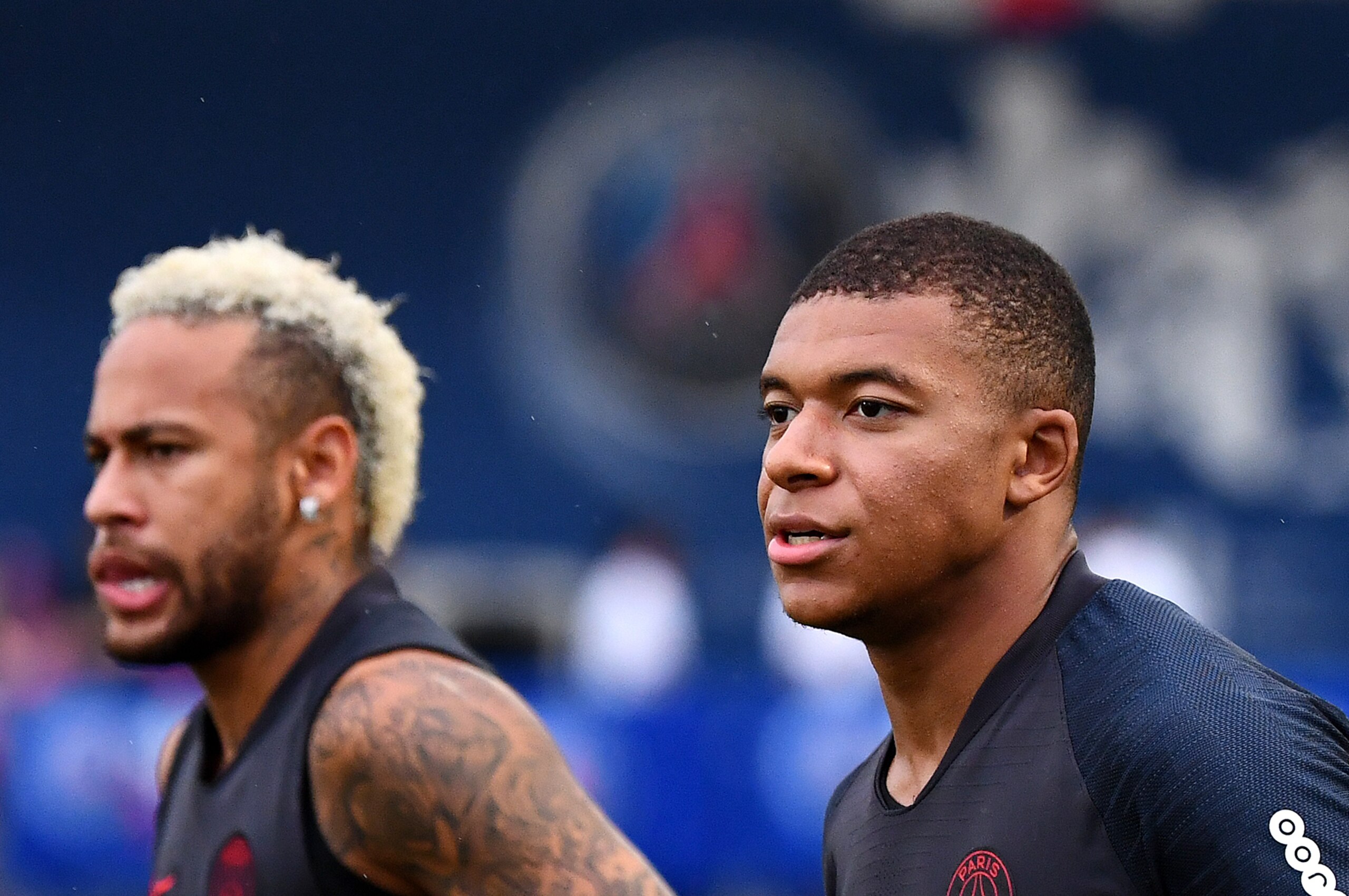 Paris Saint-Germain's Brazilian forward Neymar (L) and Paris Saint-Germain's French forward Kylian Mbappe run during a training session at The Xixiang Sports Centre in Shenzhen on August 1, 2019, ahead of the French Trophy of Champions football match betw