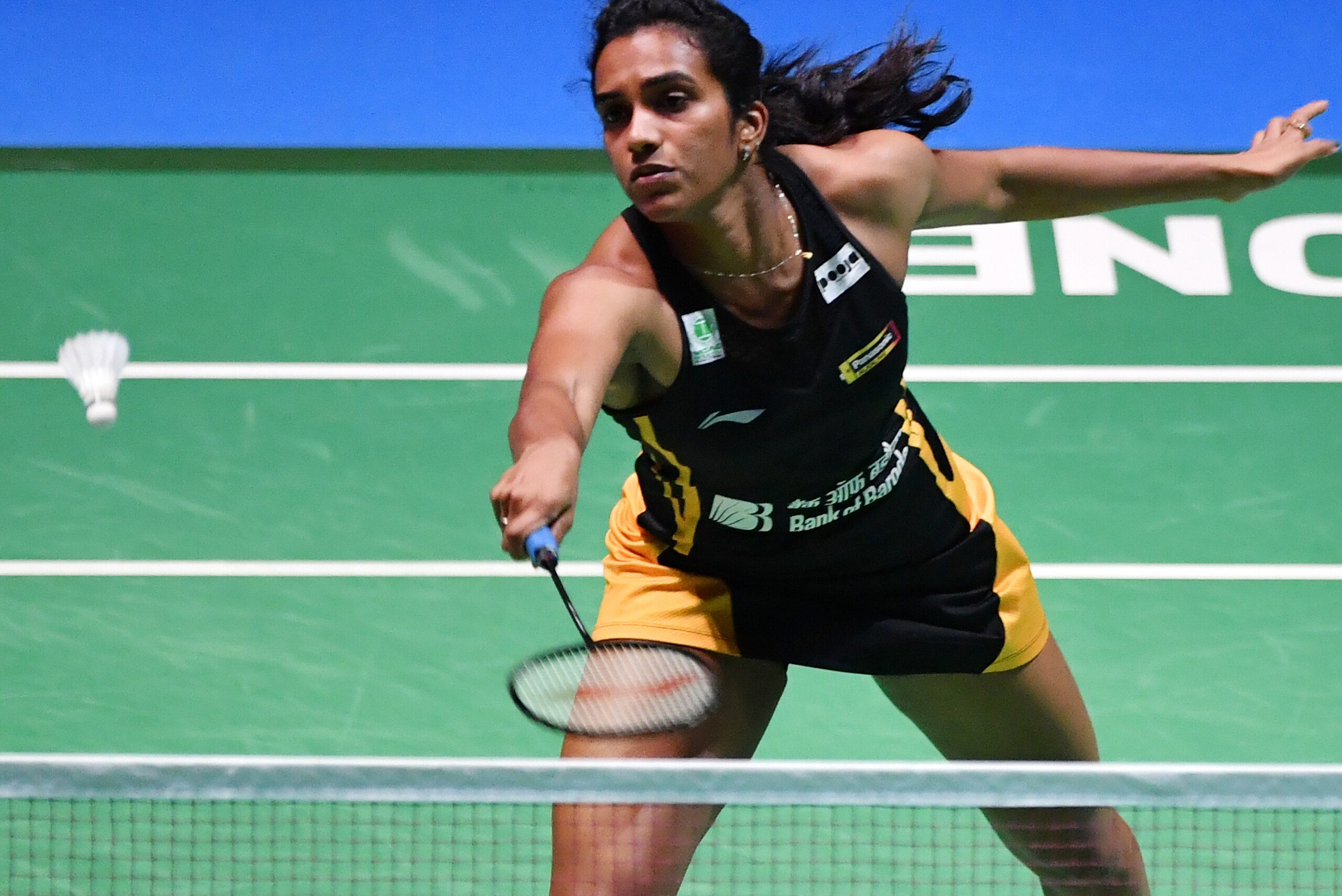 Pusarla V. Sindhu of India hits a return during her women's singles quarter-final match against Akane Yamaguchi of Japan at the Japan Open badminton tournament, a test event ahead of the Tokyo 2020 Olympic Games, in Tokyo on July 26, 2019. (Photo by TOSHI