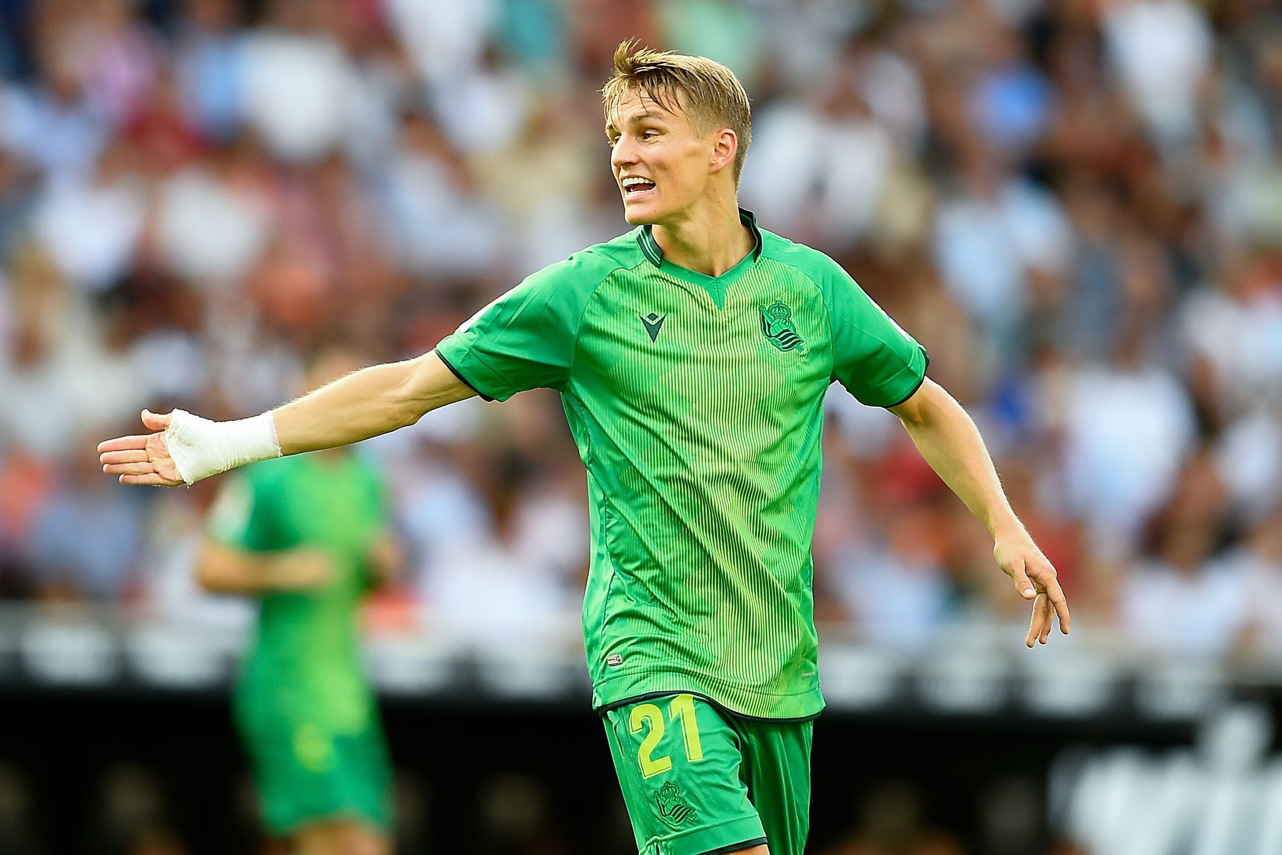 Real Sociedad's Norwegian midfielder Martin Odegaard reacts during the Spanish League football match between Valencia and Real Sociedad at the Mestalla Stadium in Valencia on August 17, 2019. (Photo by JOSE JORDAN / AFP)        (Photo credit should read J