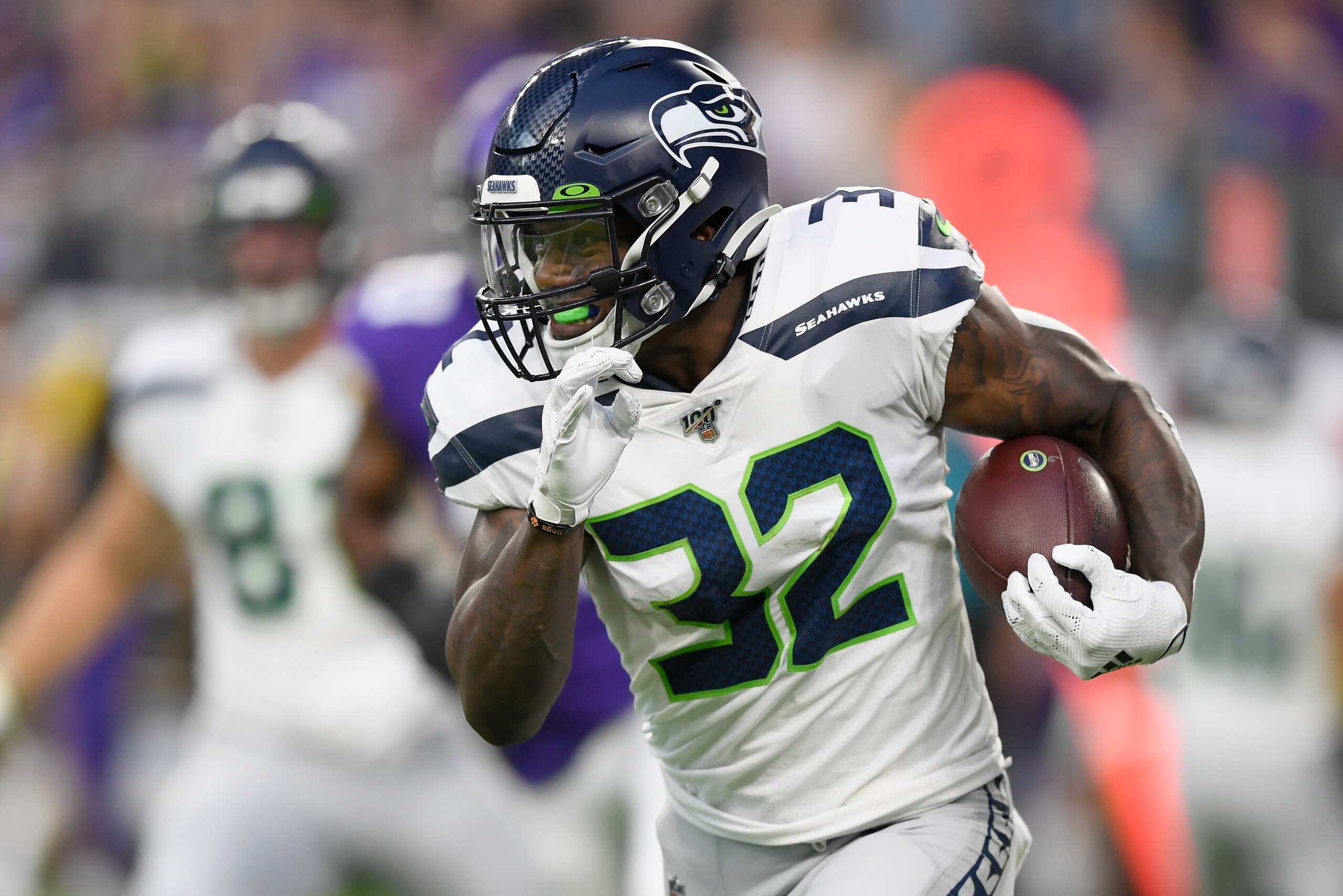 MINNEAPOLIS, MN - AUGUST 18: Chris Carson #32 of the Seattle Seahawks carries the ball against the Minnesota Vikings during the first quarter of the preseason game at U.S. Bank Stadium on August 18, 2019 in Minneapolis, Minnesota. (Photo by Hannah Foslien