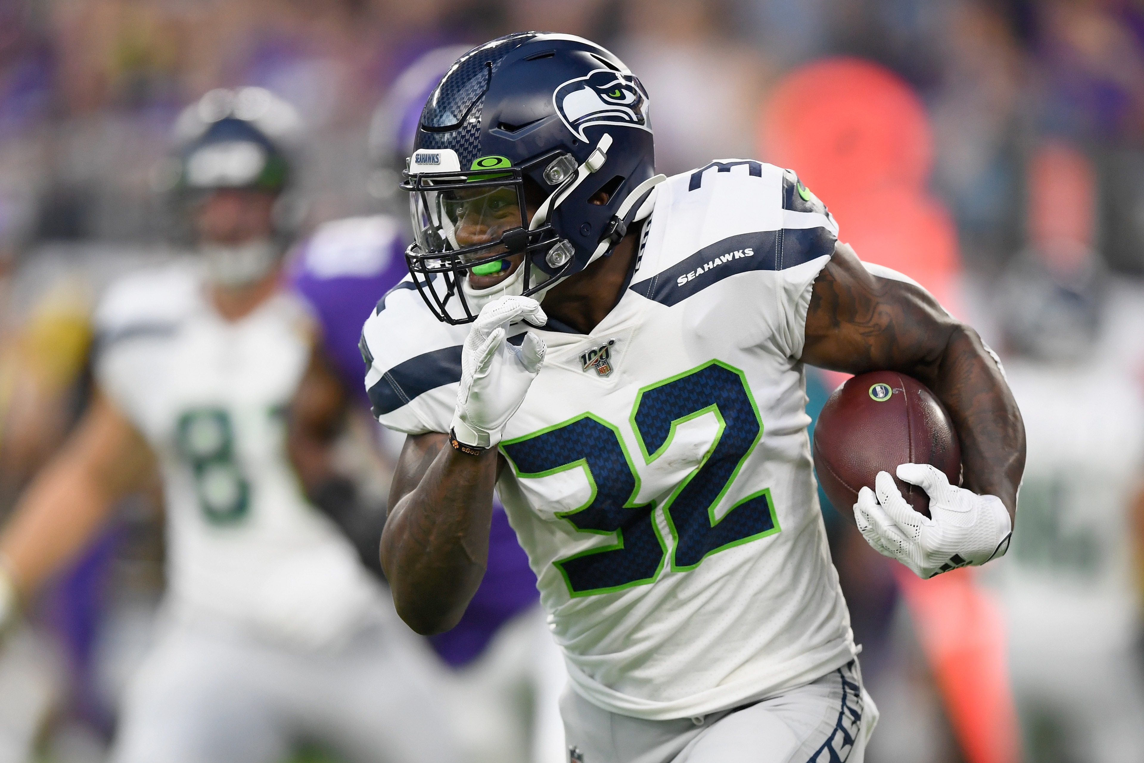 MINNEAPOLIS, MN - AUGUST 18: Chris Carson #32 of the Seattle Seahawks carries the ball against the Minnesota Vikings during the first quarter of the preseason game at U.S. Bank Stadium on August 18, 2019 in Minneapolis, Minnesota. (Photo by Hannah Foslien