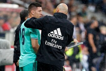 SALZBURG, AUSTRIA - AUGUST 07: Luka Jovic (Real Madrid) speaks with head coach Zinedine Zidane (Real Madrid) during the pre-season friendly match between RB Salzburg and Real Madrid at Red Bull Arena on August 07, 2019 in Salzburg, Austria. (Photo by TF-I