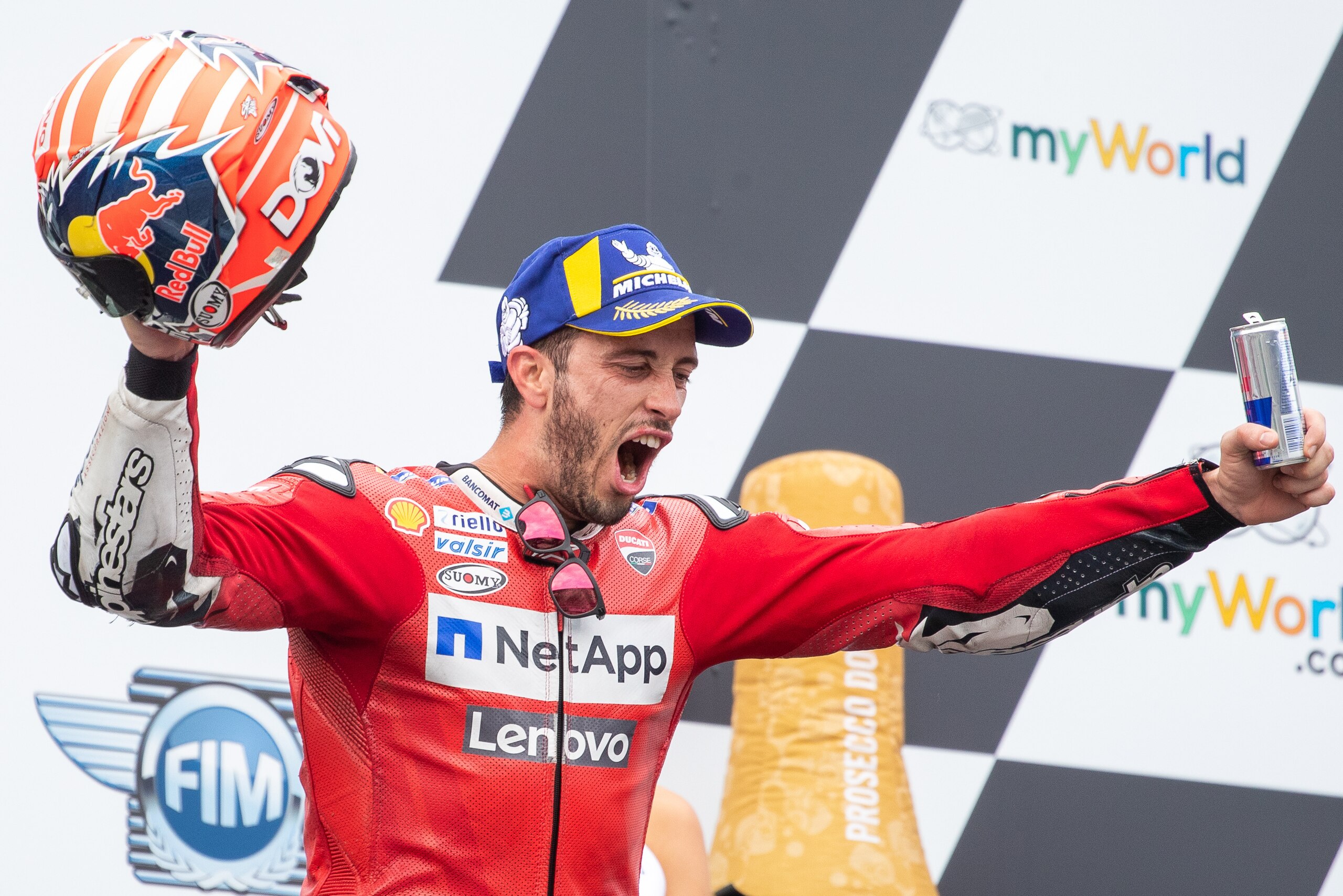 Mission Winnow Ducati's Italian rider Andrea Dovizioso (1st) celebrates on the podium after the Austrian Moto GP Grand Prix in Spielberg on August 11, 2019. (Photo by Johann GRODER / various sources / AFP) / Austria OUT / SOUTH TYROL OUT (Photo cre Mission Winnow Ducati's Italian rider Andrea Dovizioso (1st) celebrates on the podium after the Austrian Moto GP Grand Prix in Spielberg on August 11, 2019. (Photo by Johann GRODER / various sources / AFP) / Austria OUT / SOUTH TYROL OUT (Photo cre