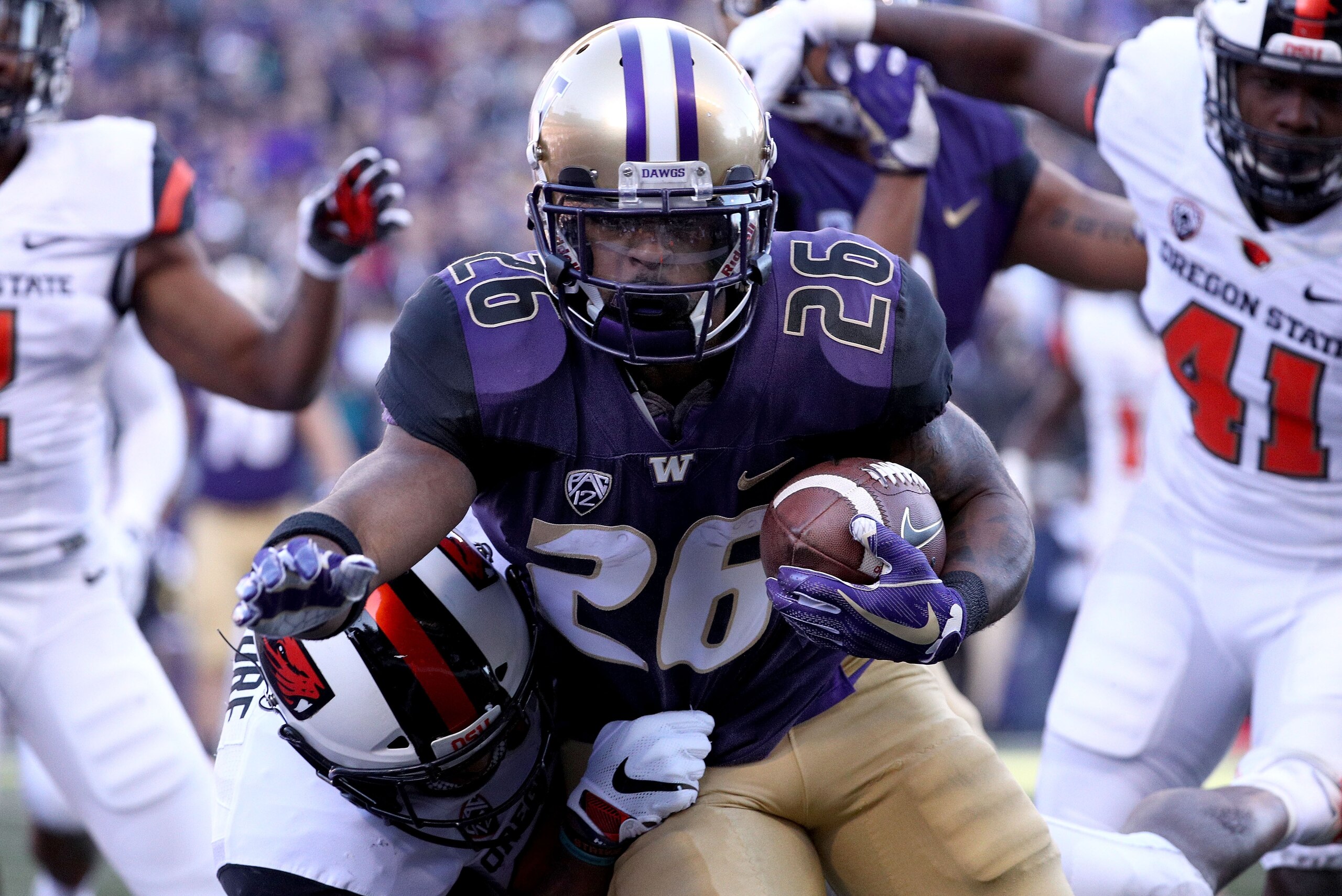 SEATTLE, WA - NOVEMBER 17: Salvon Ahmed #26 of the Washington Huskies runs for a four yard touchdown against the Oregon State Beavers in the first quarter during their game at Husky Stadium on November 17, 2018 in Seattle, Washington. (Photo by Abbie Par SEATTLE, WA - NOVEMBER 17: Salvon Ahmed #26 of the Washington Huskies runs for a four yard touchdown against the Oregon State Beavers in the first quarter during their game at Husky Stadium on November 17, 2018 in Seattle, Washington. (Photo by Abbie Par