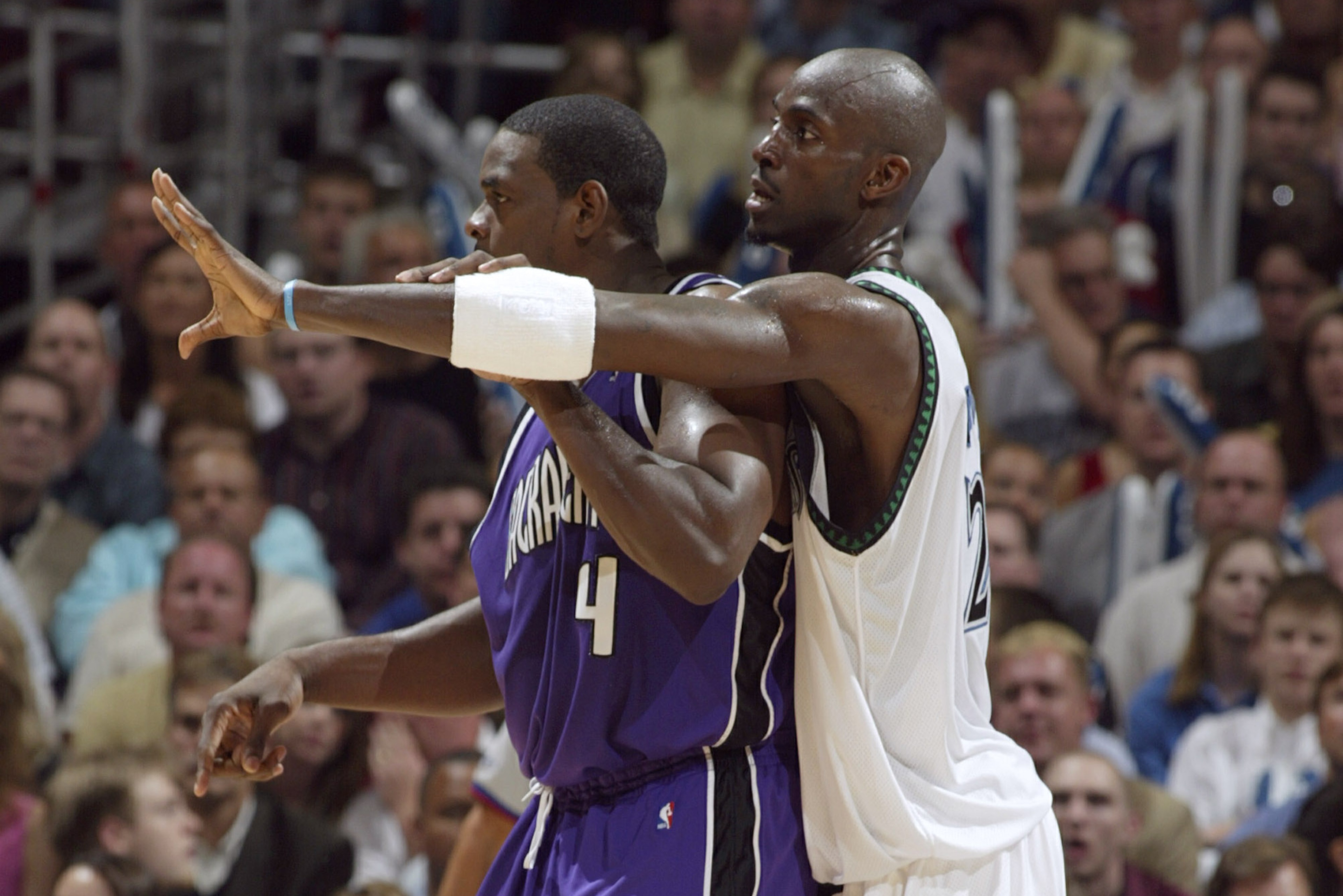MINNEAPOLIS - MAY 19:  Kevin Garnett #21 of the Minnesota Timberwolves defends Chris Webber #4 of the Sacramento Kings in Game Seven of the Western Conference Semifinals during the 2004 NBA Playoffs at Target Center on May 19, 2004 in Minneapolis, Minneso