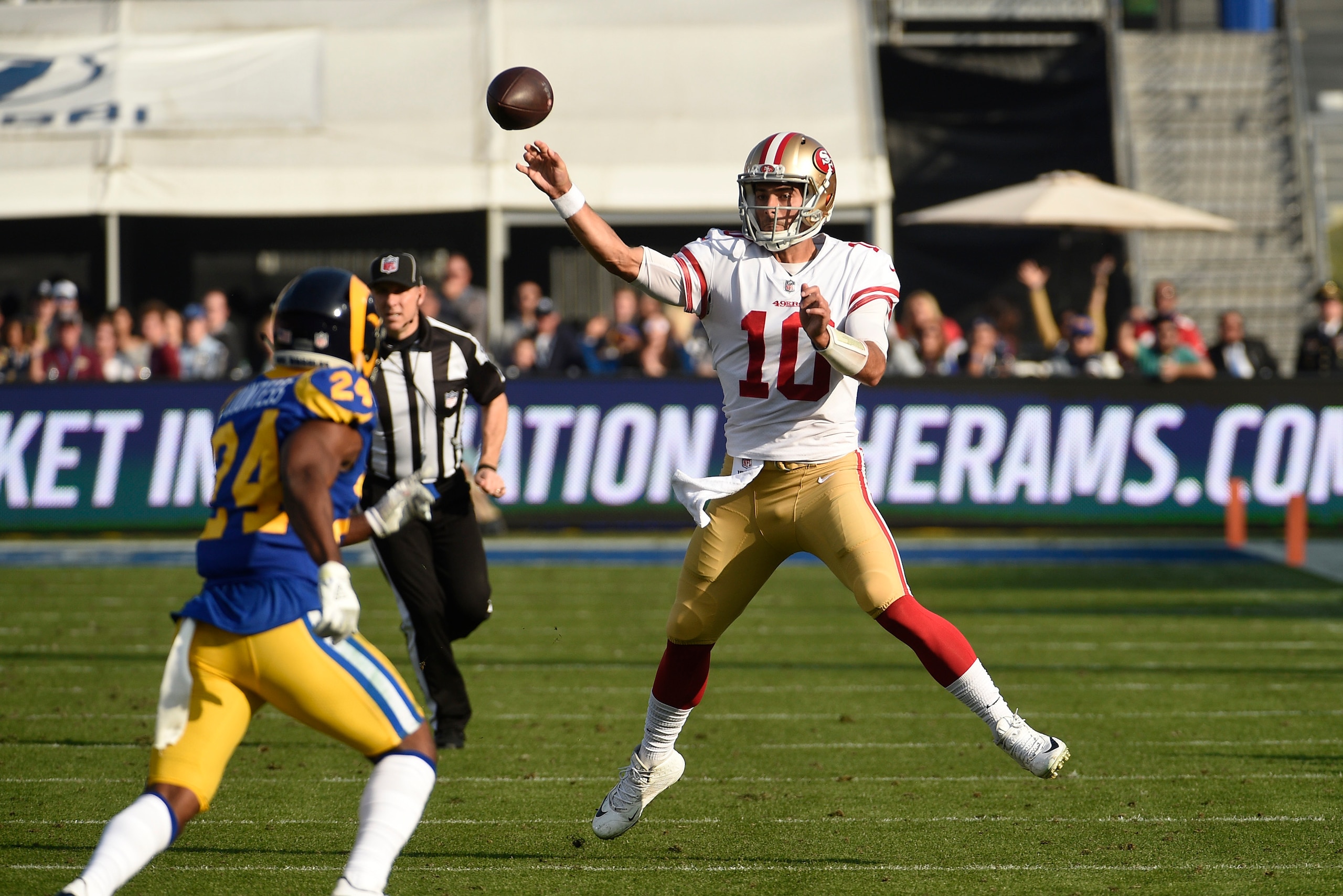 LOS ANGELES, CA - DECEMBER 31: Quarterback Jimmy Garoppolo #10 of the San Francisco 49ers throws a pass against Blake Countess #24 of the Los Angeles Rams during the second quarter at Los Angeles Memorial Coliseum on December 31, 2017 in Los Angeles, Cali