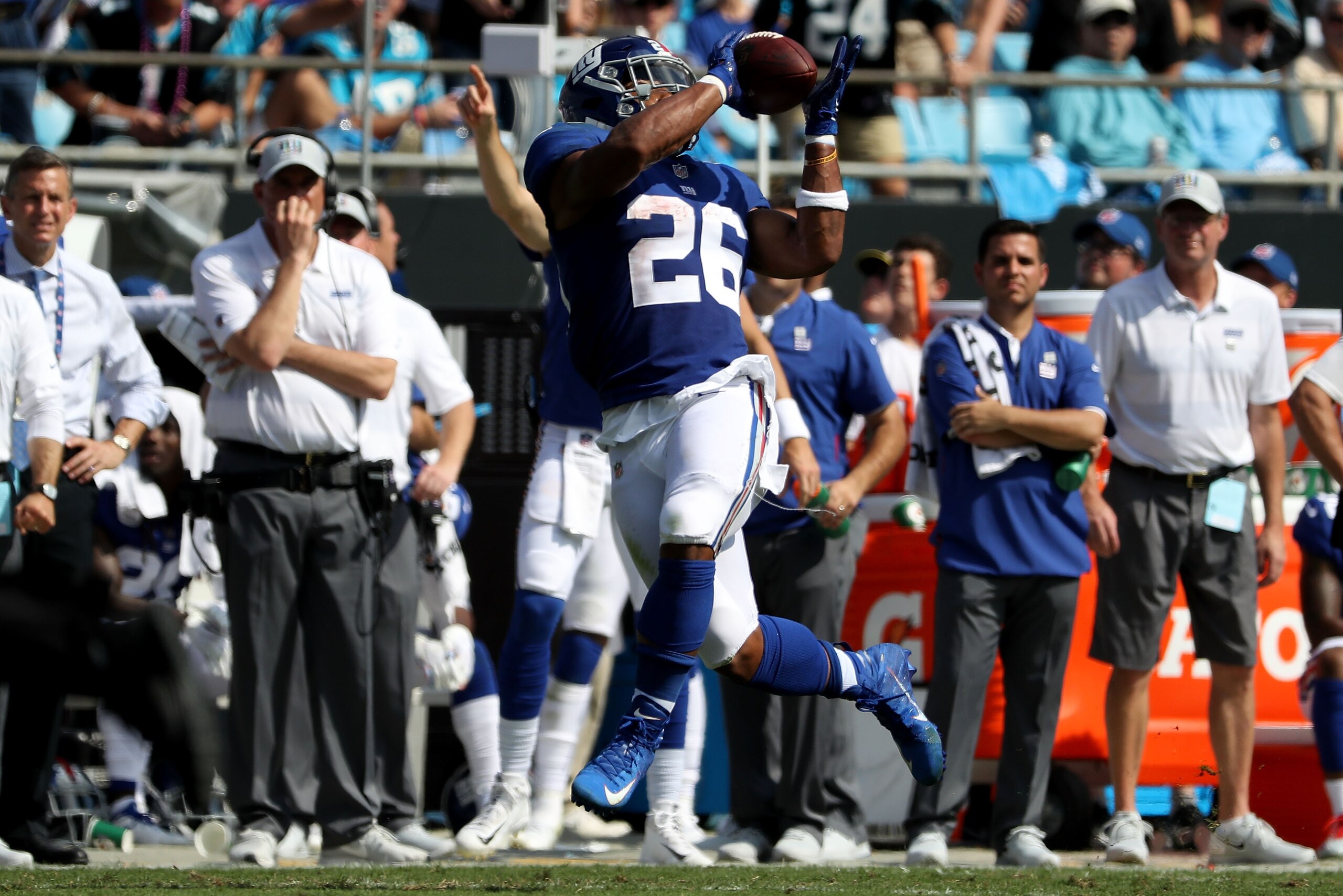 CHARLOTTE, NC - OCTOBER 07: Saquon Barkley #26 catches a touchdown pass from teammate Odell Beckham Jr. #13 of the New York Giants during their game against the Carolina Panthers at Bank of America Stadium on October 7, 2018 in Charlotte, North Carolina. CHARLOTTE, NC - OCTOBER 07: Saquon Barkley #26 catches a touchdown pass from teammate Odell Beckham Jr. #13 of the New York Giants during their game against the Carolina Panthers at Bank of America Stadium on October 7, 2018 in Charlotte, North Carolina.