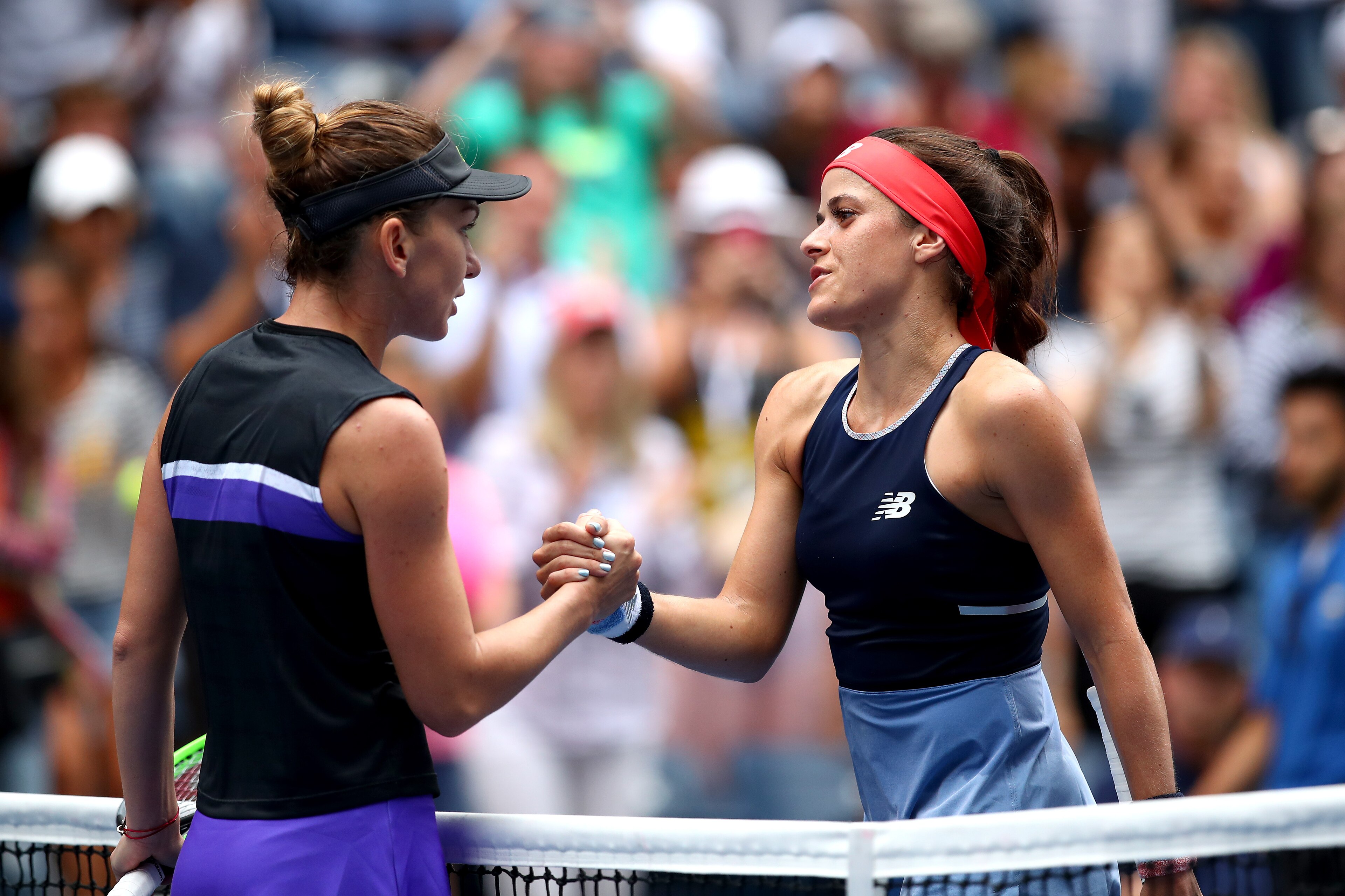 NEW YORK, NEW YORK - AUGUST 27: Simona Halep of Romania and  Nicole Gibbs of the United States shake hands following their Women's Singles first round match on day two of the 2019 US Open at the USTA Billie Jean King National Tennis Center on August 27, 2