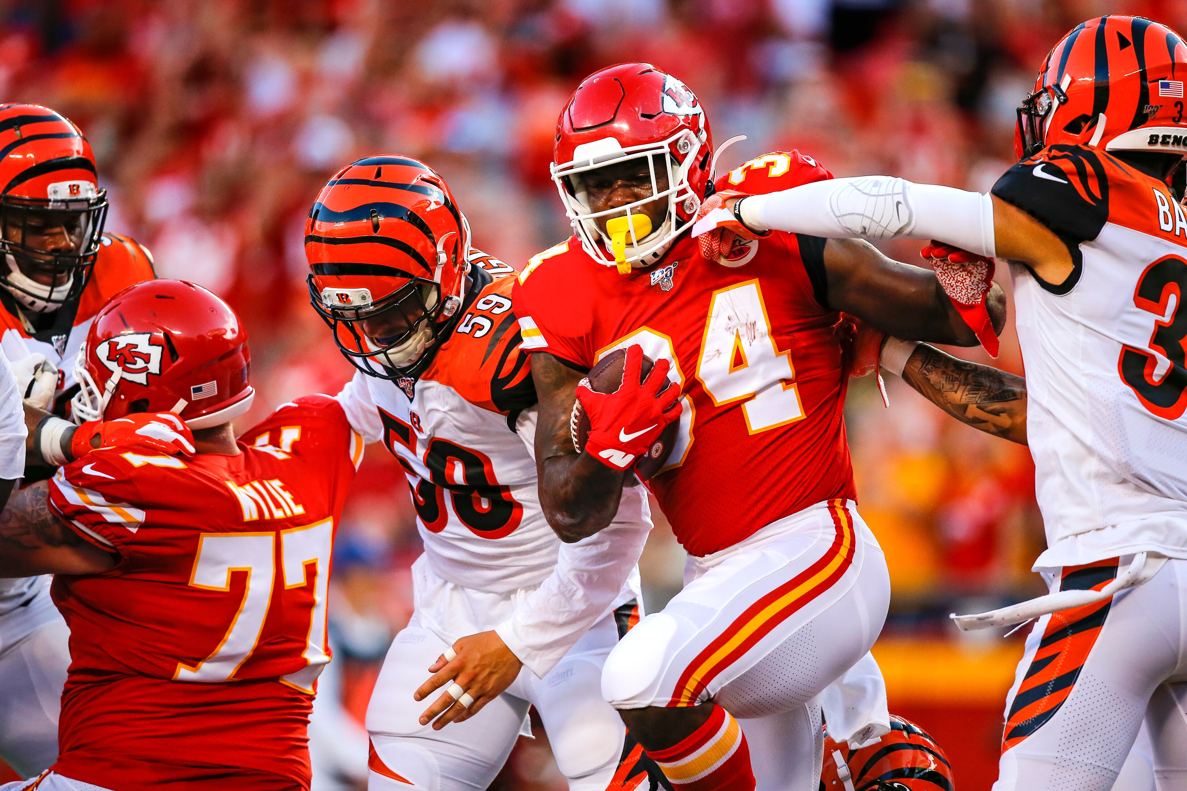 KANSAS CITY, MO - AUGUST 10: Carlos Hyde #34 of the Kansas City Chiefs scores a touchdown in the first quarter as Jessie Bates III #30 of the Cincinnati Bengals pushes Hyde at Arrowhead Stadium on August 10, 2019 in Kansas City, Missouri. (Photo by David KANSAS CITY, MO - AUGUST 10: Carlos Hyde #34 of the Kansas City Chiefs scores a touchdown in the first quarter as Jessie Bates III #30 of the Cincinnati Bengals pushes Hyde at Arrowhead Stadium on August 10, 2019 in Kansas City, Missouri. (Photo by David
