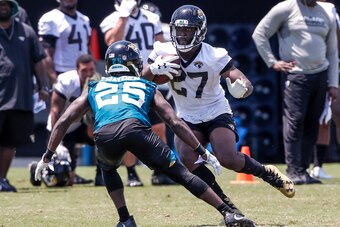 JACKSONVILLE, FL - JULY 27: Runningback Leonard Fournette #27 goes one on one with Cornerback D.J. Hayden #25 of the Jacksonville Jaguars during Training Camp at Dream Finders Homes Practice Complex on July 27, 2018 in Jacksonville, Florida. (Photo by Don