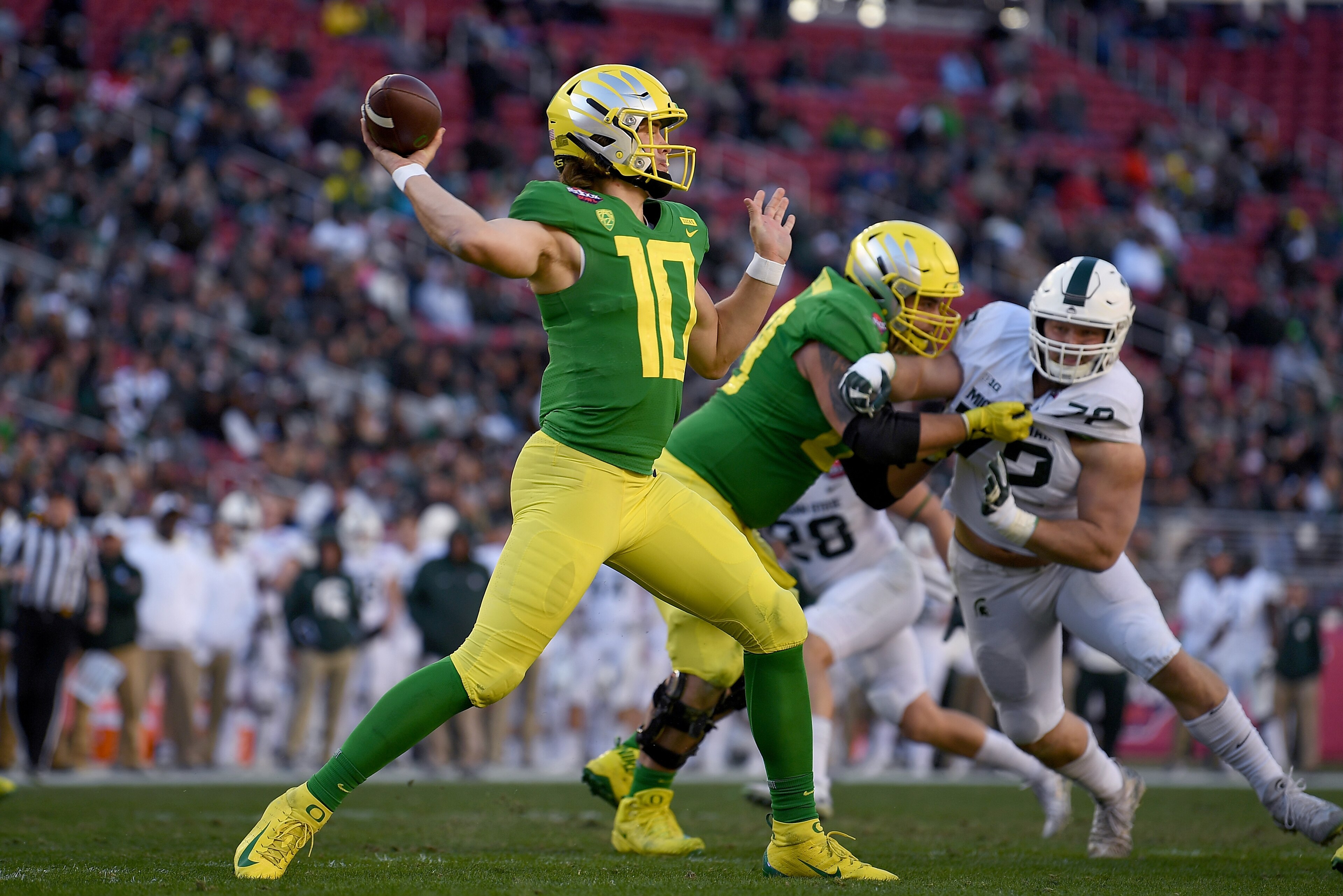 SANTA CLARA, CA - DECEMBER 31:  Justin Herbert #10 of the Oregon Ducks looks to pass against the Michigan State Spartans during the second half of the Redbox Bowl at Levi's Stadium on December 31, 2018 in Santa Clara, California.  (Photo by Thearon W. Hen
