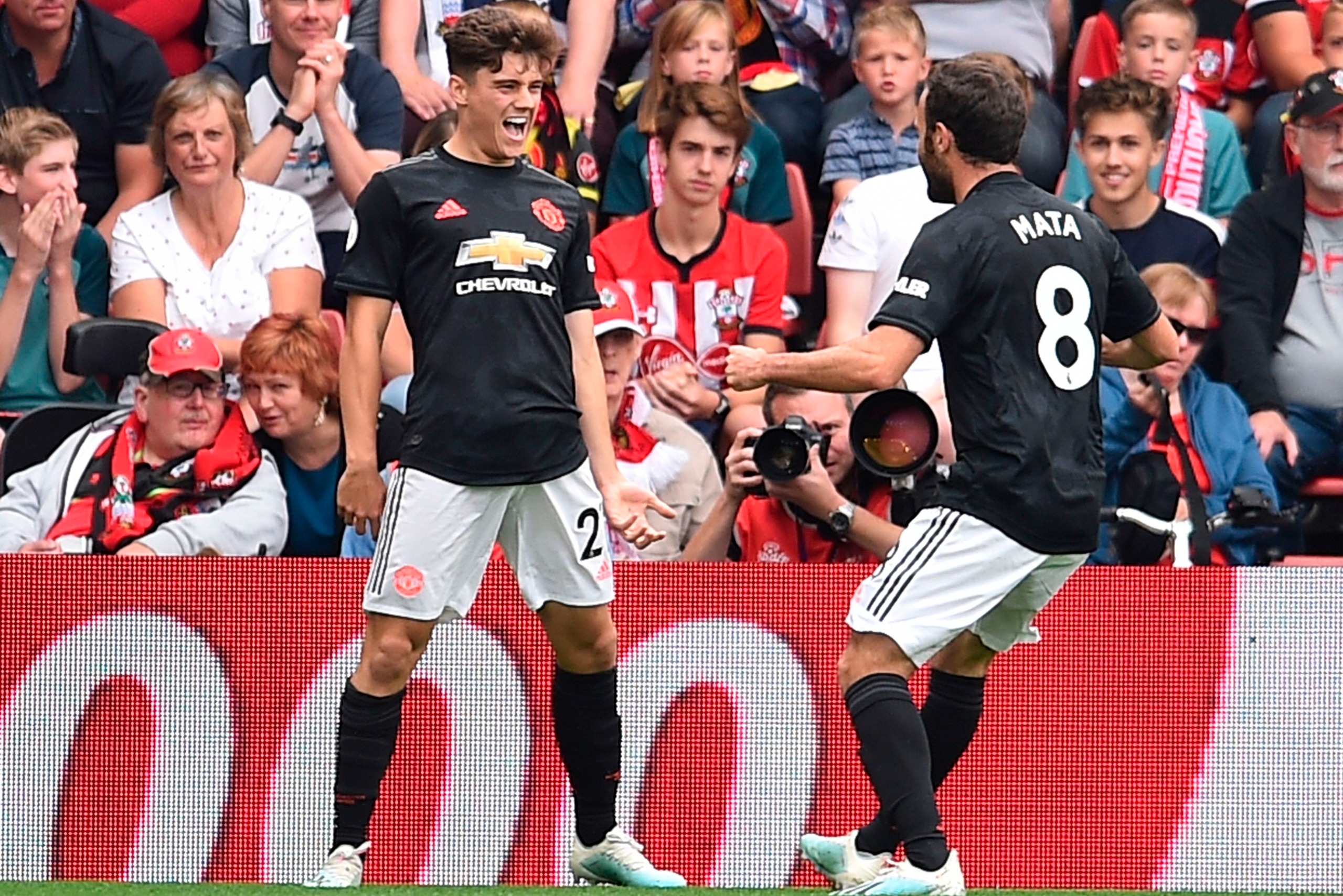Manchester United's Welsh midfielder Daniel James (L) celebrates scoring the opening goal during the English Premier League football match between Southampton and Manchester United at St Mary's Stadium in Southampton, southern England on August 31, 2019. 