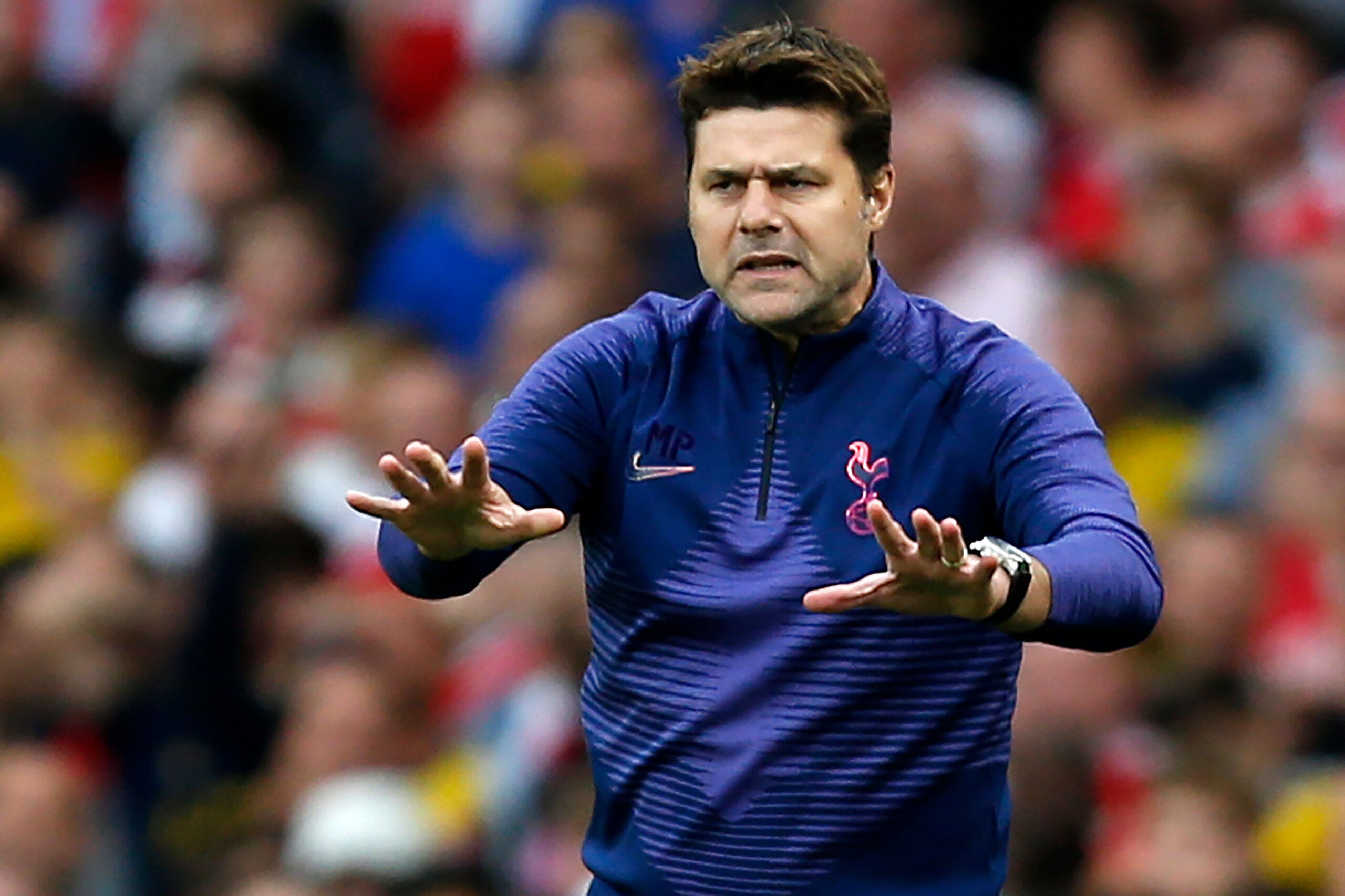 Tottenham Hotspur's Argentinian head coach Mauricio Pochettino gestures on the touchline during the English Premier League football match between Arsenal and Tottenham Hotspur at the Emirates Stadium in London on September 1, 2019. (Photo by Ian KINGTON /