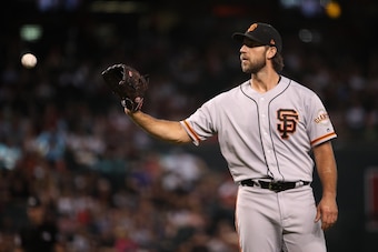 PHOENIX, ARIZONA - AUGUST 18:  Starting pitcher Madison Bumgarner #40 of the San Francisco Giants catches a throw back during the third inning of the MLB game against the Arizona Diamondbacks at Chase Field on August 18, 2019 in Phoenix, Arizona. (Photo b