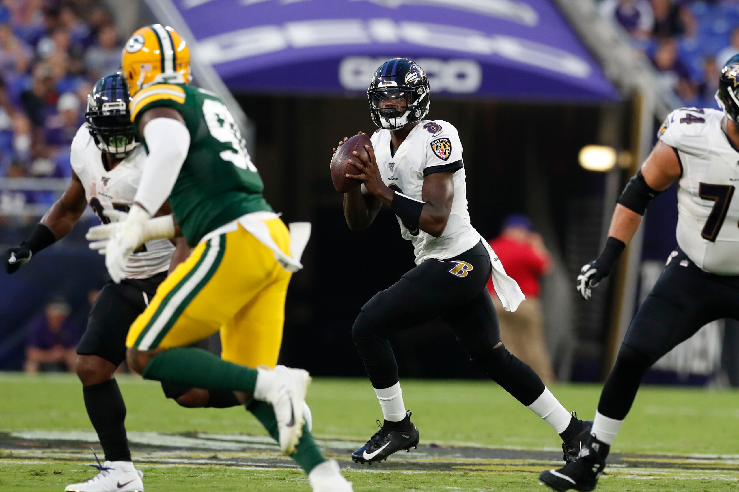 BALTIMORE, MARYLAND - AUGUST 15: Lamar Jackson #8 of the Baltimore Ravens looks to throw the ball in the first half of a preseason game against the Green Bay Packers at M&T Bank Stadium on August 15, 2019 in Baltimore, Maryland. (Photo by Todd Olszewski/G BALTIMORE, MARYLAND - AUGUST 15: Lamar Jackson #8 of the Baltimore Ravens looks to throw the ball in the first half of a preseason game against the Green Bay Packers at M&T Bank Stadium on August 15, 2019 in Baltimore, Maryland. (Photo by Todd Olszewski/G