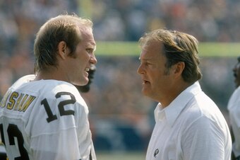 UNSPECIFIED - CIRCA 1978:  Terry Bradshaw #12 of the Pittsburgh Steelers talks with head coach Chuck Noll during an NFL football game circa `1978. Noll was the head coach of the Steelers from 1969-91. (Photo by Focus on Sport/Getty Images)
