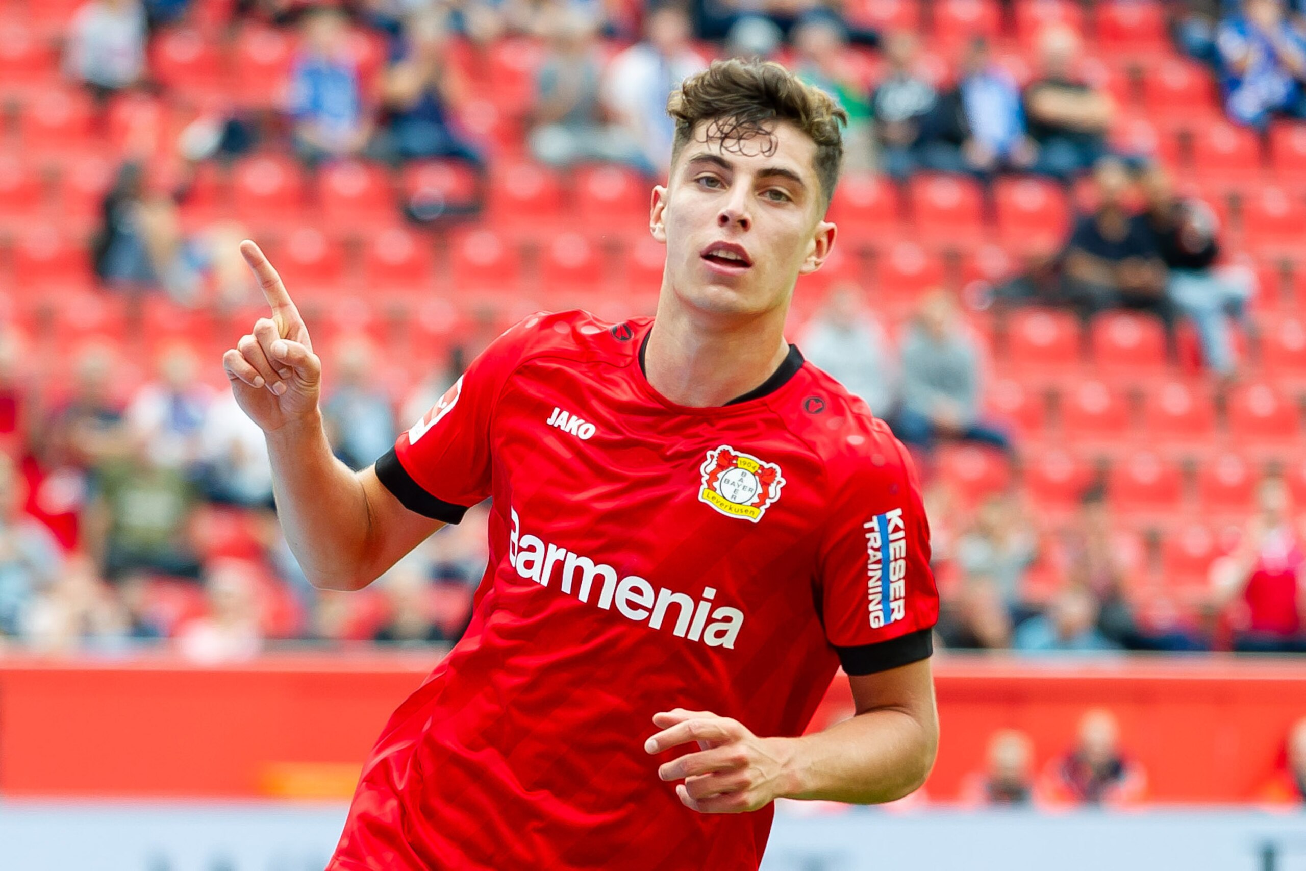 LEVERKUSEN, GERMANY - AUGUST 17: Kai Havertz of Bayer 04 Leverkusen celebrates after scoring his team's second goal during the Bundesliga match between Bayer 04 Leverkusen and SC Paderborn 07 at BayArena on August 17, 2019 in Leverkusen, Germany. (Photo b