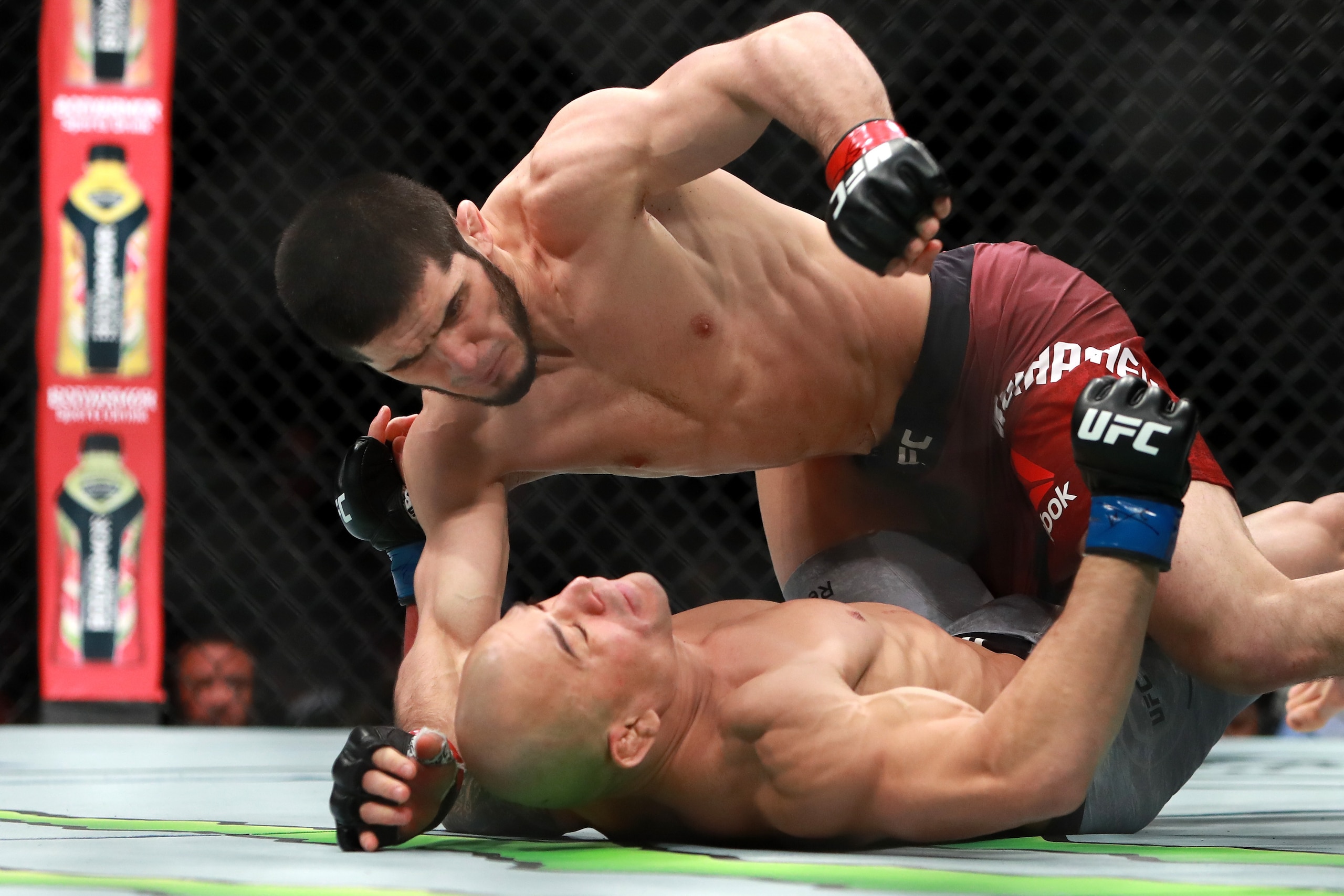 BOSTON, MA - JANUARY 20:  Islam Makhachev punches Gleison Tibau in the first round of their Lightweight fight during UFC 220 at TD Garden on January 20, 2018 in Boston, Massachusetts.  (Photo by Mike Lawrie/Getty Images)