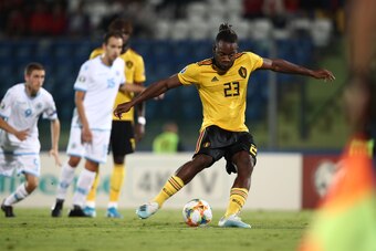 Belgium's forward Michy Batshuayi shoots a penalty to open the scoring during the Euro 2020 qualifier football match San Marino vs Belgium on September 6, 2019 at the Olympic stadium in Serravalle. (Photo by Isabella BONOTTO / AFP)        (Photo credit sh