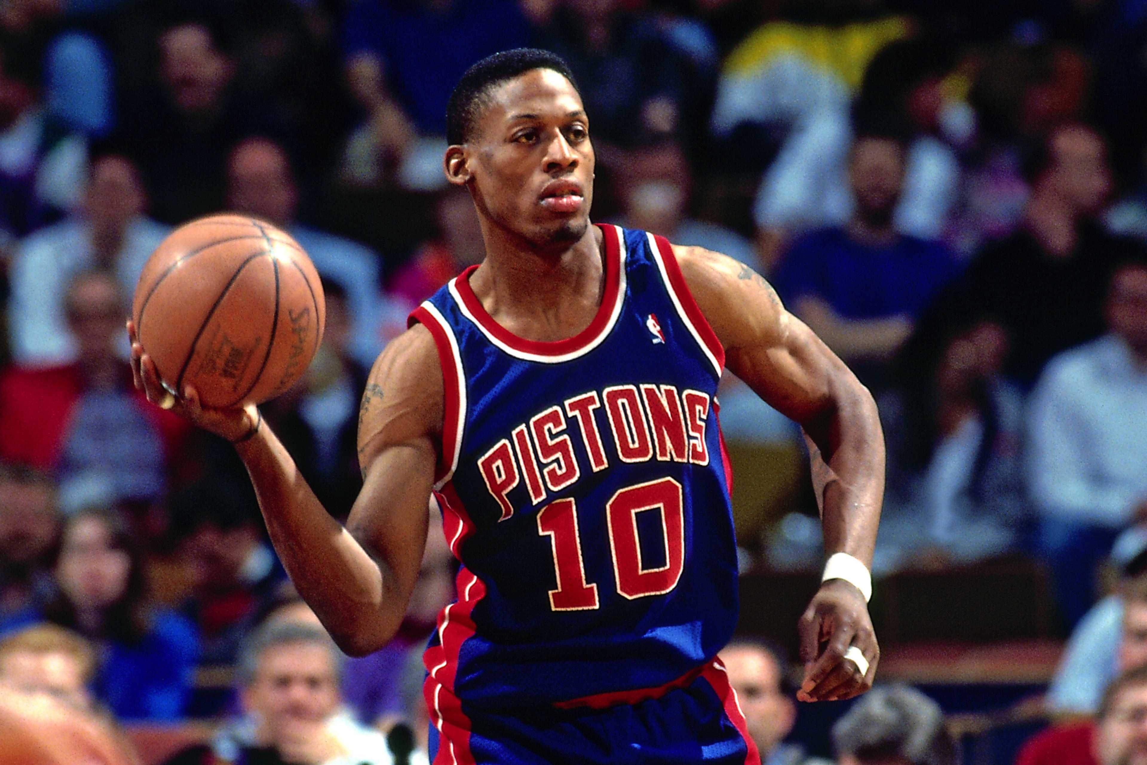 RICHFIELD, OH - 1993:  Dennis Rodman #10 of the Detroit Pistons passes the ball during the game against the Cleveland Cavaliers during a game played circa 1993 at the Richfield Coliseum in Richfield, Ohio. NOTE TO USER: User expressly acknowledges and agr