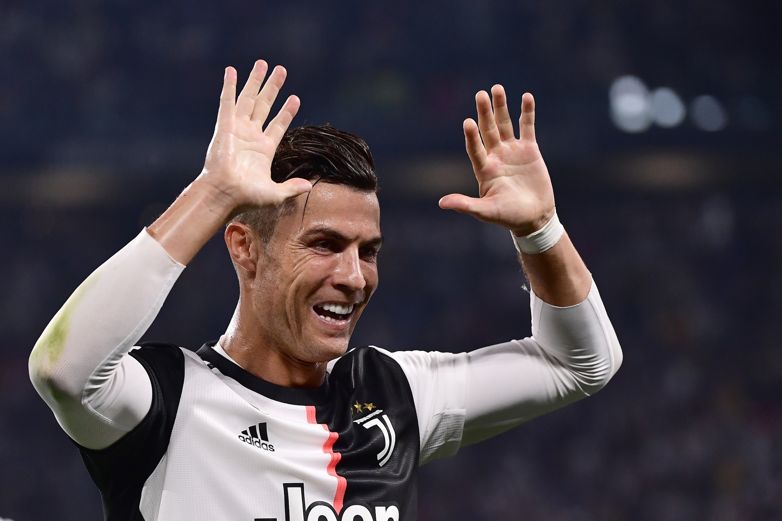 Juventus' Portuguese forward Cristiano Ronaldo celebrates his team's opening goal during the Italian Serie A football match Juventus vs Napoli on August 31, 2019 at the Juventus stadium in Turin. (Photo by Marco Bertorello / AFP)        (Photo credit shou