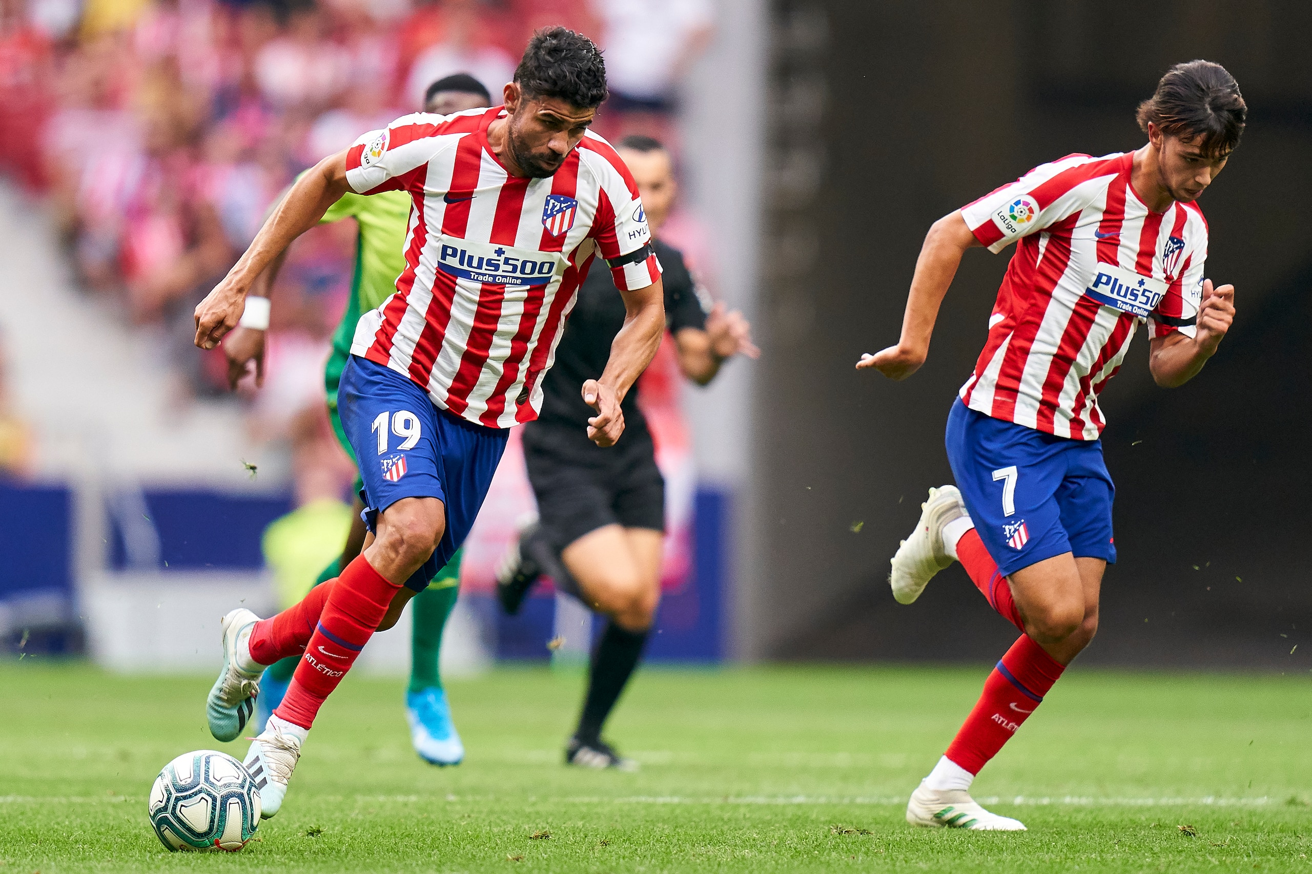 MADRID, SPAIN - SEPTEMBER 01: Diego Costa and Joao Felix of Atletico de Madrid runs with the ball during the La Liga match between Club Atletico de Madrid and SD Eibar SAD at Wanda Metropolitano on September 01, 2019 in Madrid, Spain. (Photo by Quality Sp